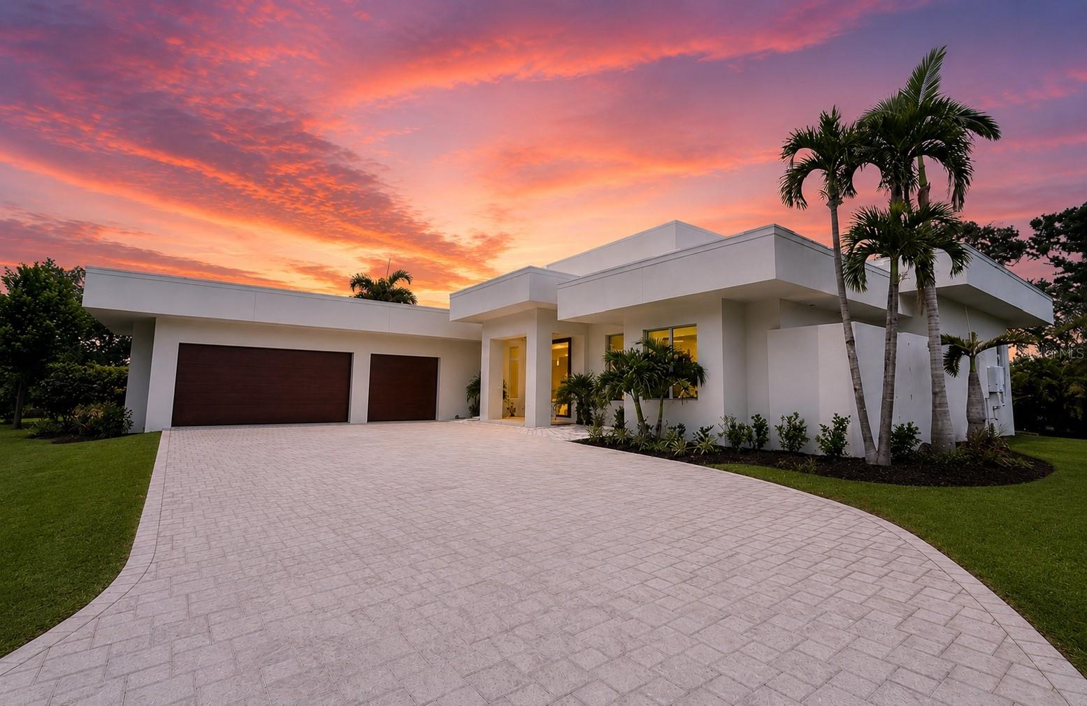 Stunning New Construction on Prime Lakefront Lot in exclusive Oyster Bay Estates.
Welcome to modern luxury living, safely outside the flood zone and offering a refined alternative to barrier island life. This brand-new contemporary masterpiece combines striking architectural design with uncompromising quality construction.

Built with solid block construction, impact windows, and dramatic 10-foot impact sliders throughout, this home delivers both beauty and peace of mind.  Step inside through the beautiful Mahogany front door to soaring ceilings up to 21 feet and wide-plank French oak flooring that flows throughout the light-filled living spaces. The gourmet kitchen is a chef’s dream, featuring a Thermador Professional Series appliance package with a dual-fuel gas range, plus an oversized island perfect for entertaining and everyday gathering. 

The thoughtful split floor plan offers 4 bedrooms, 4.5 bathrooms, and a versatile den — ideal for privacy and flexible living. From the moment you walk in, the sparkling lake and resort-style pool take center stage, setting the tone for effortless Florida living. Enjoy alfresco dining and relaxing evenings in the covered outdoor kitchen and seating area overlooking the water.

Additional highlights include an oversized 3-car side-load garage, full irrigation system, and a whole-house generator for added convenience and security. Energy-efficient features include Icynene spray foam insulation and a multi-zone HVAC system with advanced filtration — smart, sustainable comfort year-round.

Ideally situated in a top-rated school district, this exceptional home offers the perfect blend of luxury, convenience, and safety. Close to the award winning beaches of Siesta Key without all the day to day traffic and also easy access to downtown. Come experience Sarasota living at its finest.