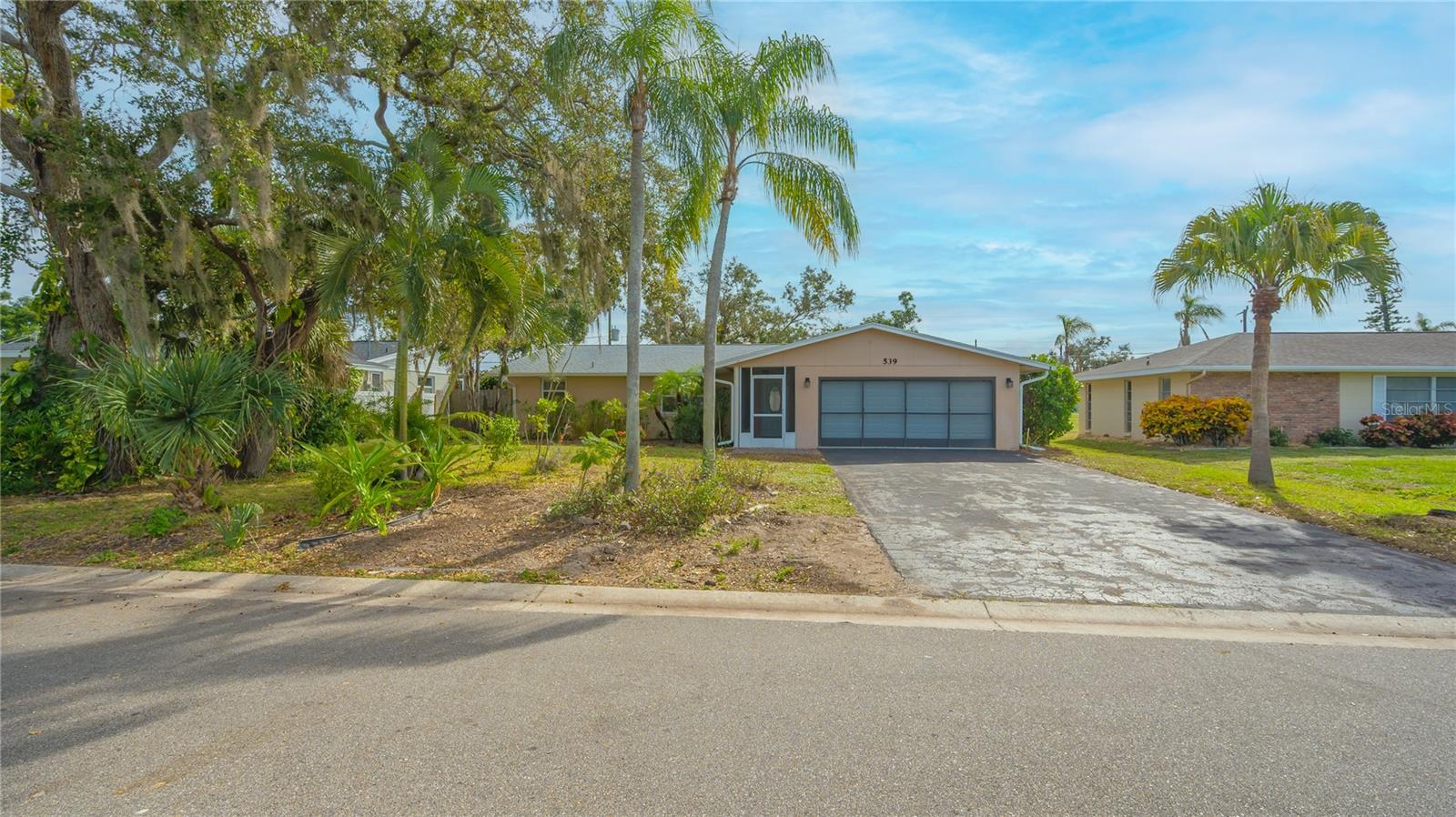 Multiple Offers. Highest and Best due by Thursday, Jan 11 at 7pm  A lovely 3 bedroom, 2 bath home with an open floor plan and ceramic tile throughout awaits you! Centrally located in Venice, this neighborhood boasts NO HOA and NO Deed Restrictions!!!
This home features a new roof in 2021; re-piped in 2023; new water heater in 2023; freshly painted interior; new gutters and downspouts installed in 2023; and a whole house water filter and water softener.
This property provides a spacious fenced backyard where you can putz in your own garden or relax on your brick pavered lanai and enjoy the many trees on the property including oak trees, avocado, peach, peanut butter, cashew and mango trees. The landscaping is a diamond in the rough, awaiting your tweaking! There is a well for irrigation. 
The 2-car garage boasts a durable epoxy floor. There is a home warranty provided for your convenience and peace of mind. 
This home is located near all that Venice has to offer:  Beaches, shopping, the arts and easy access to Sarasota and the Interstate. Don’t miss this comfortable home!