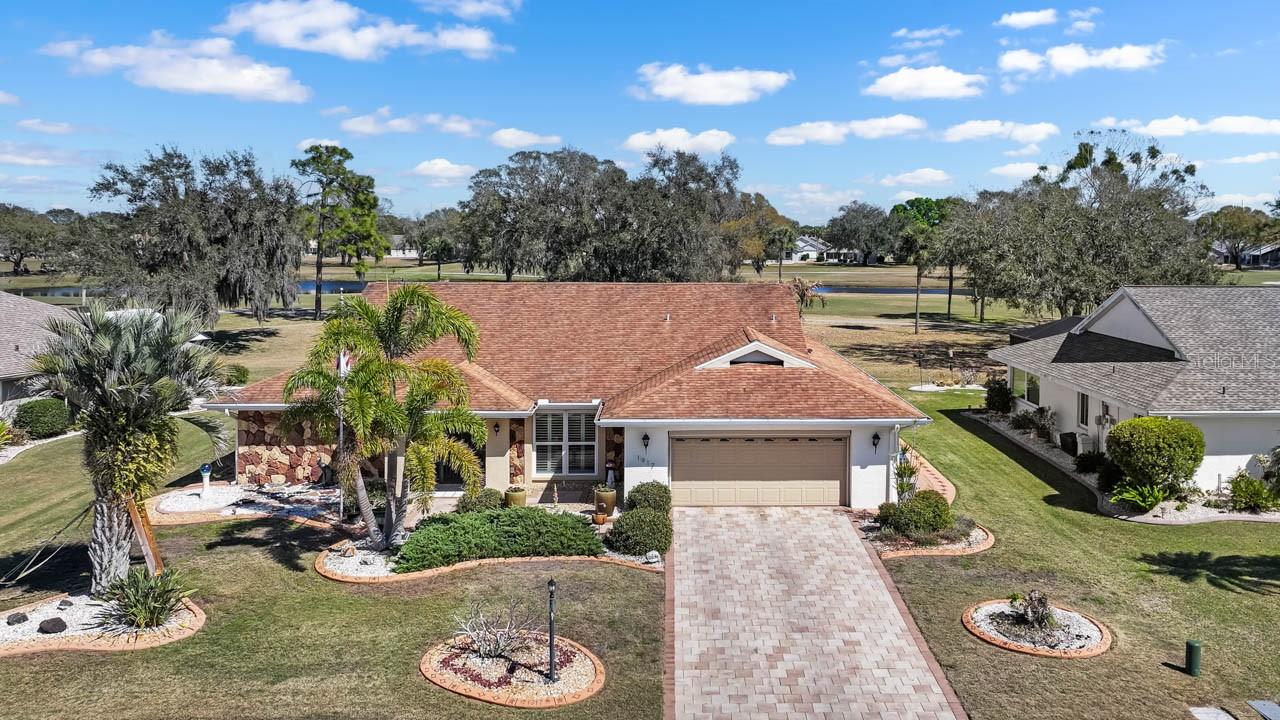 Beautiful 3-bed, 2-bath, 2-car HEATED POOL HOME with GOLF COURSE VIEW in the lovely Caloosa Country Club Estates neighborhood in the dynamic 55+ community of Sun City Center! Featuring PLANTATION SHUTTERS, pocket doors, CHAIR RAIL, mature landscaping with STAMPED CURBING, PAVER DRIVEWAY, Nest thermostat, NEWER hot water heater (2023), remote control sprinkler system, and REVERSE OSMOSIS. The pool includes a roll-on cover, NEW pump & heater, and is surrounded by a PAVER DECK and SCREENED CAGE. There is also a 7-PERSON HOT TUB for ultimate relaxation! Enter through the COVERED & SCREENED FRONT PORCH to a lovely open concept layout. The kitchen shines with its GRANITE COUNTERTOPS, STAINLESS STEEL APPLIANCES including a BRAND NEW REFRIGERATOR (2026), WOOD CABINETRY, dinette space, and WET BAR with its own sink! The dining room has incredible build-ins surrounding the gorgeous view. The primary bedroom comes equipped with a WALK-IN CLOSET and EN-SUITE BATHROOM, complete with a DUAL-SINK VANITY and WALK-IN SHOWER! The secondary bedrooms and bathroom are located on the other side of this SPLIT-BEDROOM floorplan, allowing additional privacy, and one of the bedrooms even has its own WALK-IN CLOSET! The Laundry Room includes its own cabinetry and LG washer/dryer, and the garage features a WORKBENCH and its own refrigerator! Overall, this home is poised to be both a respite and a destination. Sun City Center is a community designed with resident enjoyment in mind. Find peace and fun in this beautiful home and neighborhood. Schedule your showing today!