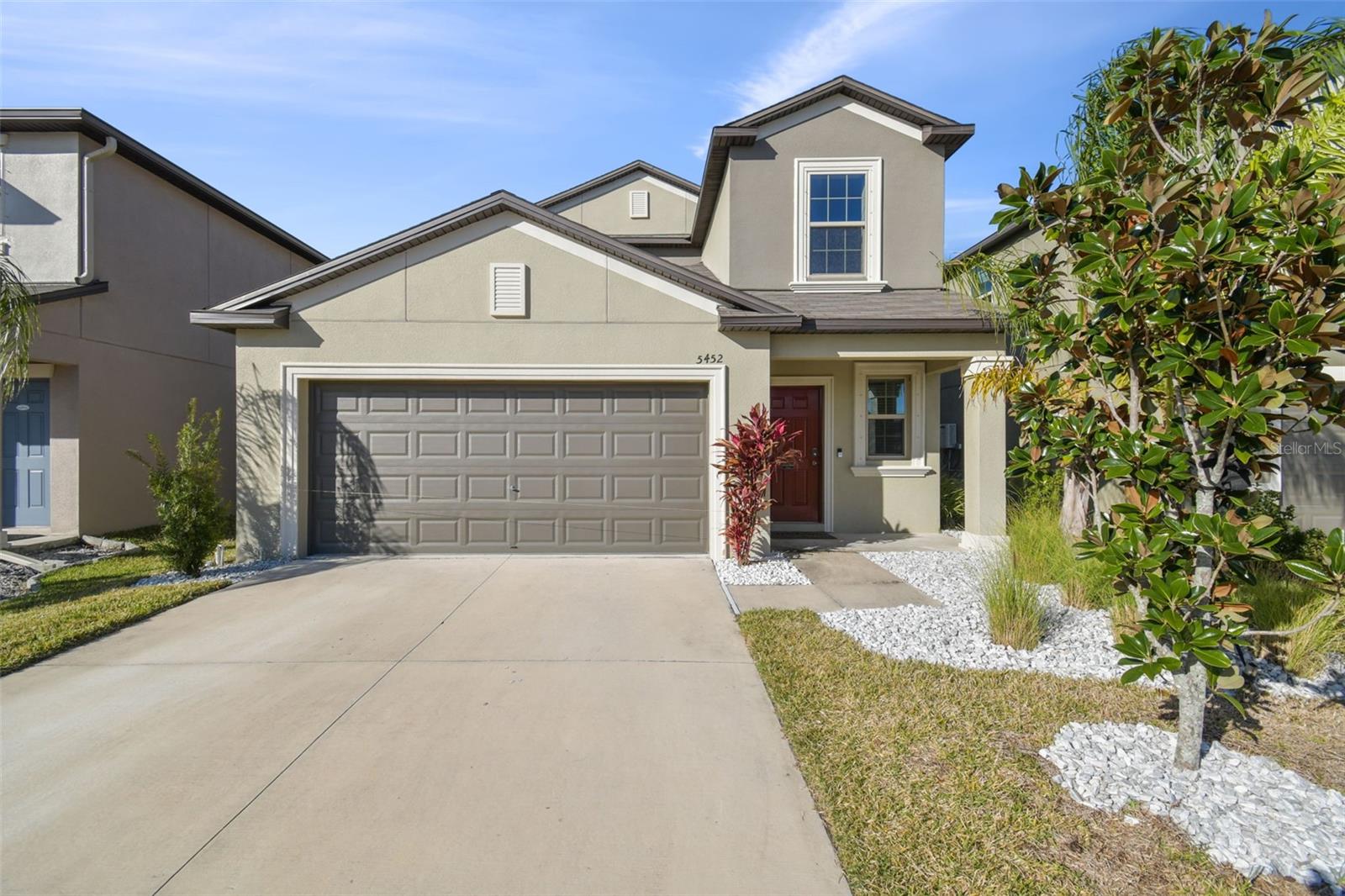 Welcome to 5452 Rainwood Meadows Dr, where TRANQUIL POND VIEWS and NO REAR NEIGHBORS set the stage for this stunning 5-BEDROOM, 2.5-BATHROOM home that seamlessly blends modern luxury, comfort, and an unbeatable location in the heart of Apollo Beach. Nestled in the highly desirable Lynwood community, this home is designed for both everyday living and effortless entertaining.

Step inside to discover a bright and inviting foyer that leads to an OPEN-CONCEPT floor plan, perfectly designed for both relaxing and entertaining. At the heart of the home, the CHEF'S KITCHEN impresses with 42” CABINETS, GRANITE COUNTERTOPS, STAINLESS STEEL APPLIANCES, a GAS RANGE, a spacious CENTER ISLAND with seating for four, and a generous WALK-IN PANTRY. The kitchen flows effortlessly into the expansive living and dining areas, making it the ideal space for gathering with family and friends.

The main level is home to a luxurious PRIMARY SUITE, complete with a spa-like en-suite bathroom featuring dual vanities and a walk-in closet. An additional bedroom and full bathroom on this floor add versatility, whether you need a guest suite or a home office.

Upstairs, you’ll find four spacious bedrooms, a shared full bathroom with a double vanity, and a versatile loft, offering endless possibilities for play, work, or relaxation.

Outdoor living is just as impressive, with a LARGE SCREENED and COVERED PORCH that provides a perfect setting to unwind and soak in SERENE POND VIEWS and Florida’s natural beauty.

Additional features include a WATER SOFTENER and a GAS TANKLESS WATER HEATER, providing enhanced efficiency, comfort, and endless hot water throughout the home.

Situated in a prime location, this home is minutes from Tampa Bay, where you can enjoy boating, kayaking, paddleboarding, and more. Nearby attractions include E.G. Simmons Regional Park and the Manatee Viewing Center. The Lynwood community offers resort-style amenities, including a sparkling pool, clubhouse, playground, and picturesque green spaces for outdoor fun.

Centrally located between Tampa, St. Petersburg, and Sarasota, this home offers a convenient commute and endless lifestyle opportunities. Don’t miss your chance to own this beautifully crafted Apollo Beach gem—schedule your private showing today!