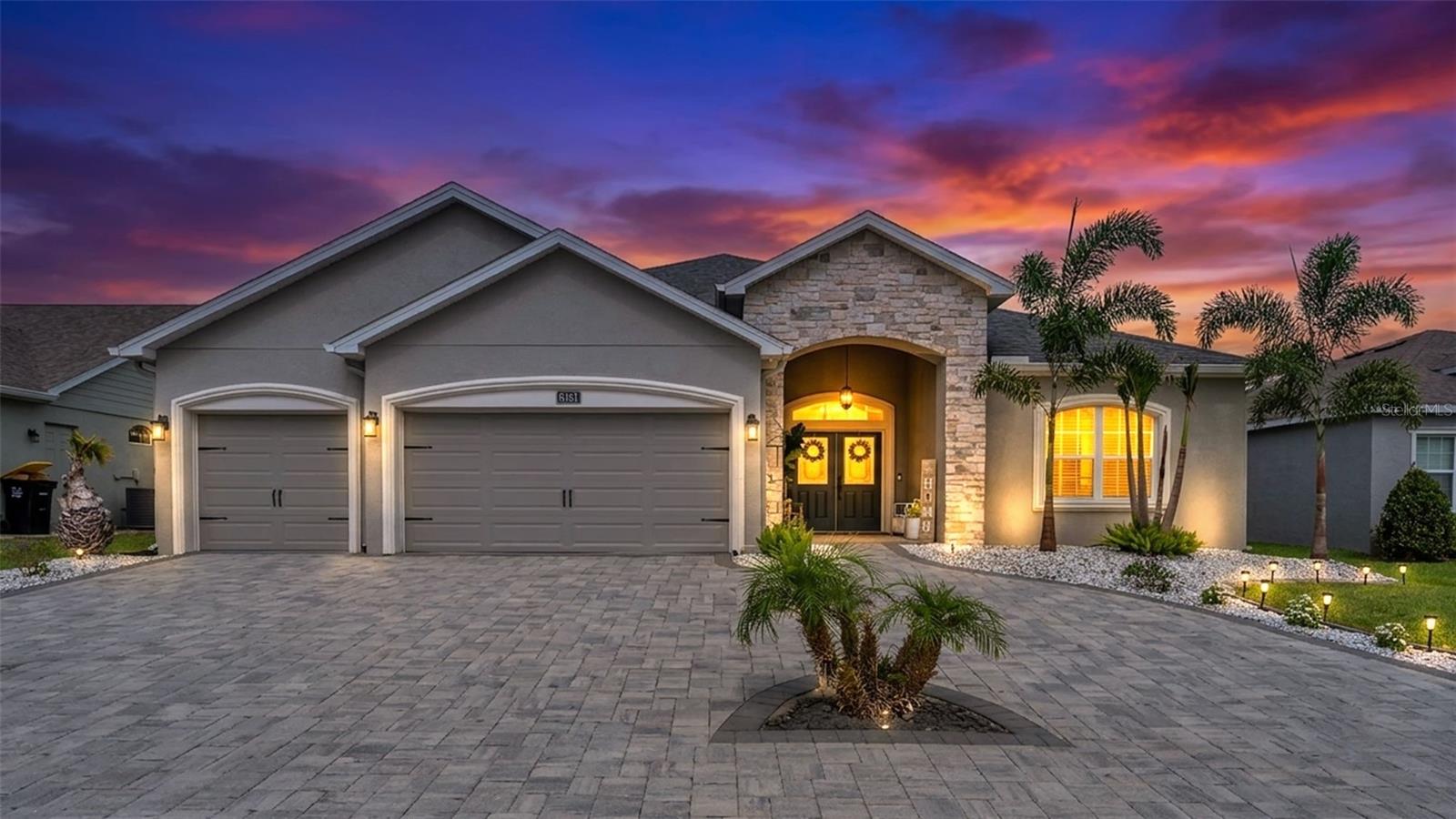 Stunning 5-Bedroom Pool Home in Gated Highlands Grace | 3,544 Under Roof | Loaded with Upgrades!

Welcome to 6191 Gracie Place, a truly exceptional residence located in South Lakeland. Built in 2019 and meticulously maintained, this stunning five-bedroom, three-bathroom home combines luxury finishes, thoughtful upgrades, and an open-concept design that is perfect for both everyday living and entertaining.  From the moment you arrive, you'll appreciate the beautiful paver driveway, manicured landscaping, and outstanding curb appeal. Step inside to discover a spacious, light-filled floor plan featuring new luxury vinyl plank flooring throughout the majority of the home, fresh paint, updated lighting fixtures, and a custom built-in bookshelf that adds both character and functionality.  The heart of the home is the expansive open-concept living area, seamlessly connecting the kitchen, dining, and family rooms to create the perfect space for gatherings of any size. The kitchen has been beautifully refreshed with freshly painted cabinetry and offers abundant storage and workspace for the home chef.  Retreat to the private owner's suite while enjoying the flexibility of four additional bedrooms, making this home ideal for large families, guests, or a home office setup. The epoxy-coated garage floors add a polished touch to the oversized garage space.  Step outside to your own backyard paradise. The two-year-old PebbleTec mini-pebble pool, complete with a heater and a nearly new screened enclosure, creates the ultimate setting for year-round enjoyment. The expansive paver patio offers plenty of room for outdoor dining and entertaining.  Additional upgrades include a whole-home water softener system, updated irrigation system, hardwired interior and exterior security cameras ready for new owner setup, and numerous features that reflect the pride of ownership found throughout this remarkable property.  Located in one of South Lakeland's most desirable gated communities, Highlands Grace offers convenience to shopping, dining, medical facilities, top-rated schools, and the Polk Parkway while maintaining a private neighborhood atmosphere. This move-in-ready showpiece is the complete package and a rare opportunity to own a beautifully upgraded home in an outstanding location.