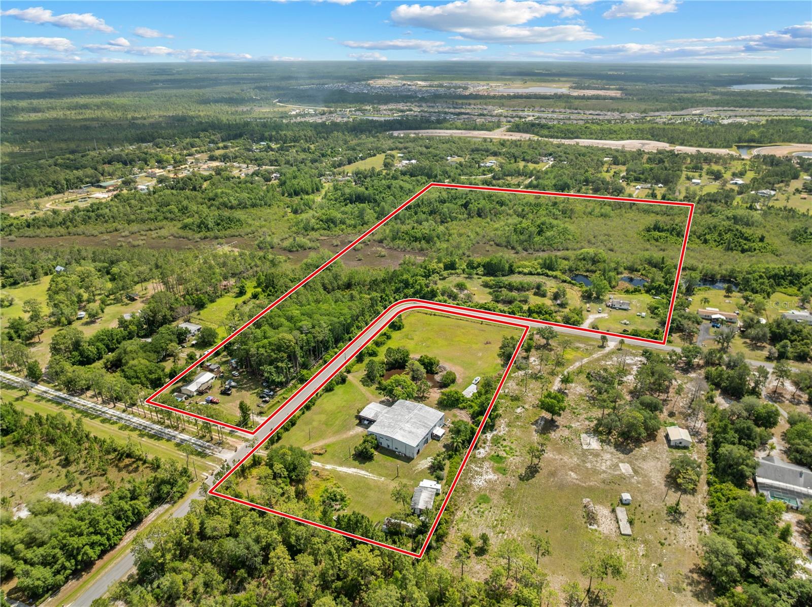 Location, Location, Location! Rare opportunity to own approximately 30.12 acres in one of Central Florida’s rapidly growing corridors. Situated in the desirable St. Cloud/Lake Nona area, this property offers exceptional potential for investors, developers, land bankers, or buyers seeking acreage in a highly sought-after location. Conveniently located just minutes from Orlando International Airport with quick access to State Road 417 and State Road 528, providing connectivity to Downtown Orlando, Lake Nona, the Space Coast, and surrounding Central Florida areas. The property is also located near Lake Nona Medical City, a growing hub for healthcare, education, technology, and innovation. Surrounded by ongoing residential and infrastructure expansion, the property is positioned near the emerging Sunbridge area and planned roadway improvements, further contributing to the area’s continued growth and accessibility. Featuring substantial road frontage, expansive acreage, and proximity to major development activity, this property presents a unique opportunity within a rapidly developing area. Enjoy the balance of privacy and convenience with nearby shopping, dining, schools, and everyday amenities while maintaining access to everything Central Florida has to offer.