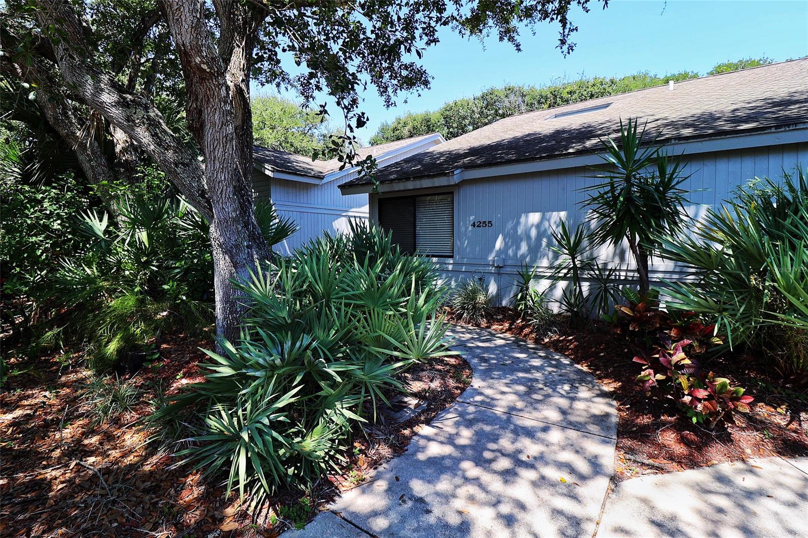 The natural beauty of SEA WOODS awaits.  Don't miss your opportunity to own this very well maintained, FULLY FURNISHED, 2/2 villa, just steps from the north pool and tennis court in this incredible BEACHSIDE COMMUNITY.  Upon entry you'll appreciate the natural light from the atrium so unique to the villas and find vinyl plank flooring, updated baths and stay cool thanks to a brand new(2022) HVAC with 10yr warranty.  Step outside the main living area to the very spacious, paver patio perfect for enjoying a good book and some shade provided by the canopy of oaks that give Sea Woods its name.  An INCREDIBLE LOCATION - just a short walk to the beautiful no-drive beach as well as several shopping and dining options.  Sea Woods features 3 pools(1 heated), tennis courts, shuffleboard, pickleball, large clubhouse, fitness center and walking/biking paths canopied by sprawling oaks and surrounded by lush tropical landscaping. Come see for yourself why Sea Woods is still one of the best kept secrets in New Smyrna Beach. ;Water: City