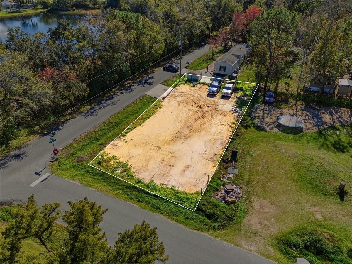 Build-ready residential lot in Kissimmee with NO HOA. Property features a new water well, new driveway, and house plans already prepared—saving time and upfront costs. Lot is suitable for a manufactured home or site-built home, ideal for buyers looking to build immediately. Convenient location near major roads, shopping, and dining. Buyer to verify zoning, building requirements, mobile home eligibility, and intended use.
