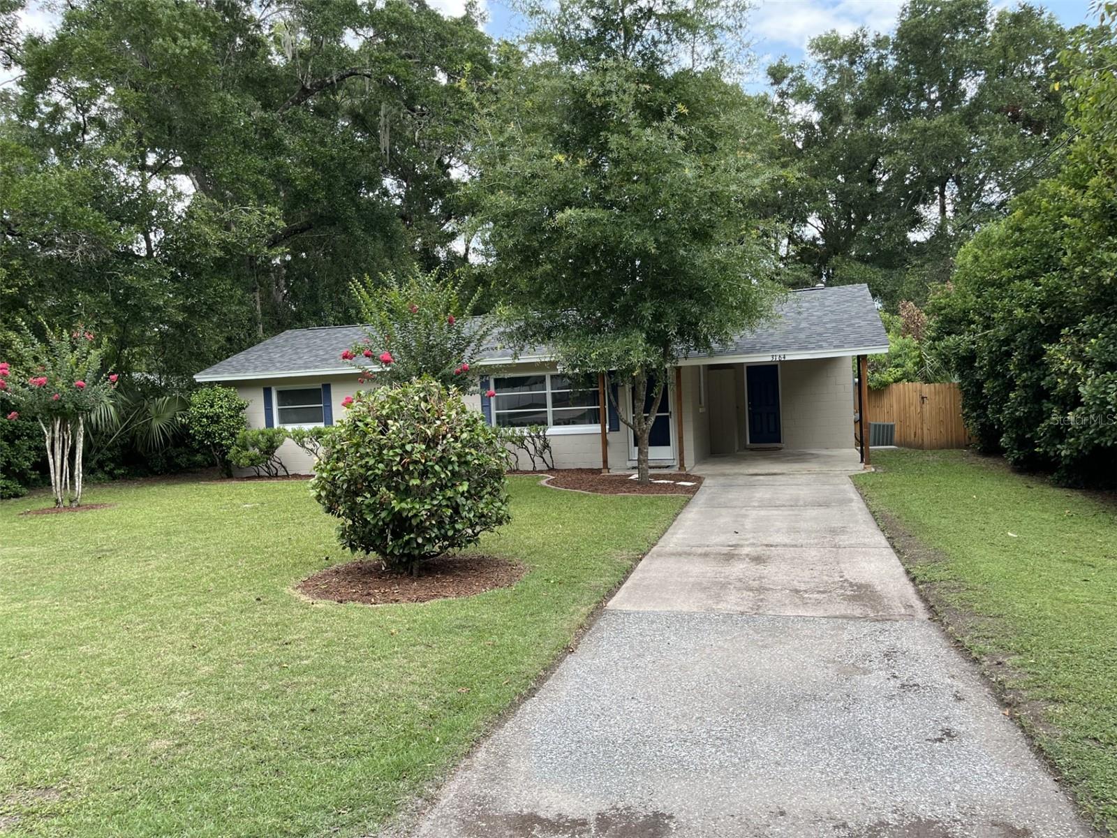 Why Rent!!! This home is 4 miles to HCA Hospital in Ocala. This home is super clean and shows better than the pictures!!  Pro pics coming soon.  Welcome home to this beautifully remodeled gem in the desirable Ocala Highlands community! This move-in ready 2-bedroom, 1 bath home offers 962 sq ft of comfortable living space on a spacious .29-acre lot (84’ x 150’) with a fully fenced yard and paved road frontage. Located in a convenient SE Ocala location, this charming home features brand new luxury vinyl flooring throughout, a new roof installed in 2025, and updated electrical wiring and panel for added peace of mind.

The completely remodeled kitchen is a standout with crisp white shaker cabinets, updated finishes, and a window overlooking the yard above the sink bringing in natural light. The updated bathroom features a tiled shower surround and stylish glass shower door. The dining area opens through sliding glass doors to the screened covered back porch, perfect for relaxing or entertaining.

Additional features include a spacious hall linen closet, attached carport, and a separate utility room with washer and dryer area. Enjoy the large backyard with plenty of room for outdoor activities, gardening, or pets. Conveniently located near Jervey Gantt Park, the Ocala Community Pool on SE 36th Avenue, shopping, dining, and schools including Ward Highlands Elementary and Forest High School.

A beautifully updated home in a great location—this one is ready for its next owner!