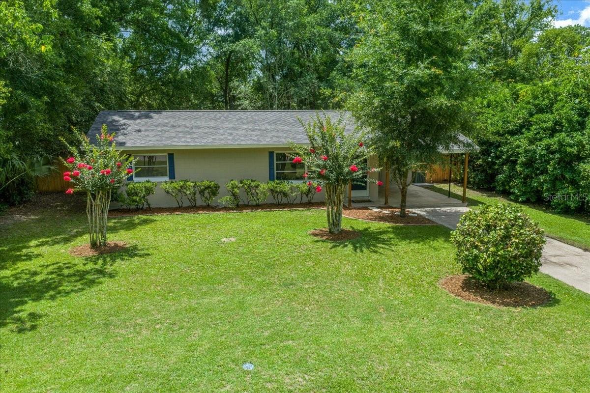 Why Rent!!! This home is 4 miles to HCA Hospital in Ocala. This home is super clean and shows better than the pictures!!  Pro pics coming soon.  Welcome home to this beautifully remodeled gem in the desirable Ocala Highlands community! This move-in ready 2-bedroom, 1 bath home offers 962 sq ft of comfortable living space on a spacious .29-acre lot (84’ x 150’) with a fully fenced yard and paved road frontage. Located in a convenient SE Ocala location, this charming home features brand new luxury vinyl flooring throughout, a new roof installed in 2025, and updated electrical wiring and panel for added peace of mind.

The completely remodeled kitchen is a standout with crisp white shaker cabinets, updated finishes, and a window overlooking the yard above the sink bringing in natural light. The updated bathroom features a tiled shower surround and stylish glass shower door. The dining area opens through sliding glass doors to the screened covered back porch, perfect for relaxing or entertaining.

Additional features include a spacious hall linen closet, attached carport, and a separate utility room with washer and dryer area. Enjoy the large backyard with plenty of room for outdoor activities, gardening, or pets. Conveniently located near Jervey Gantt Park, the Ocala Community Pool on SE 36th Avenue, shopping, dining, and schools including Ward Highlands Elementary and Forest High School.

A beautifully updated home in a great location—this one is ready for its next owner!