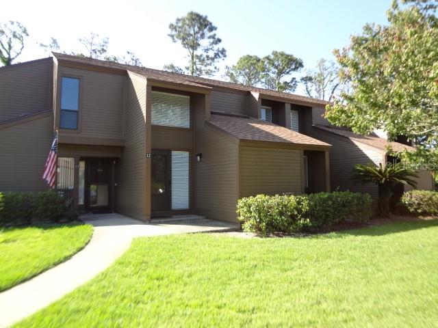 Enjoy the convenience of living in this 2-bedroom, 2 bath upstairs condo! Updates include flooring and bath fixtures. Kitchen is well equipped with double oven range, microwave, dishwasher, refrigerator and pantry. It also includes lots of counter space and a breakfast bar which connects to the informal dining area.  There are a nicely sized living area and a more formal dining area. It all overlooks the greenery of the surrounding landscape. Lots of privacy! You can't see your neighbors from your condo. Step out on the carpeted balcony to unwind after a tiring day. Located nearby (just a mile), the Island Walk Shopping Center includes a Publix Grocery Store, Hobby Lobby, a plethora of restaurants, and the beach is just 4 miles away. Plan on living in this paradise to enjoy the pool, tennis court, exercise facility and clubhouse on well-maintained grounds and own it as an investment property in the meantime. Current tenant's lease is up on April 30, 2027.