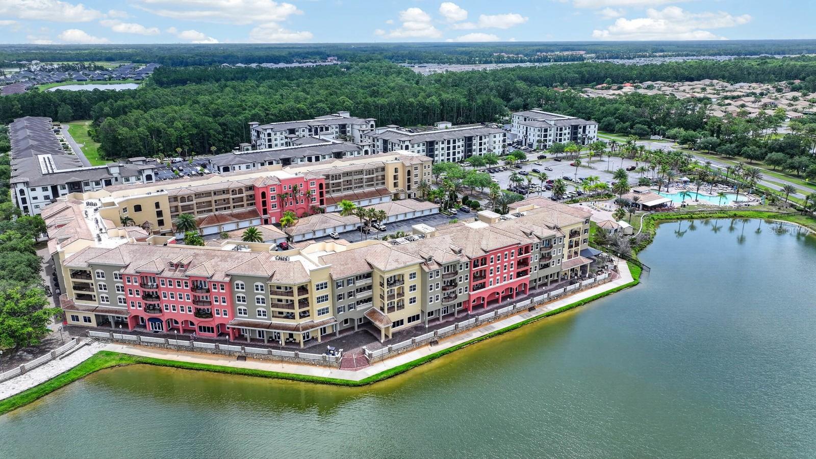 Luxury living with shops, restaurants, and services right down the elevator. Hop in your golf cart and head out to the world-famous Venetian Bay Golf Club and clubhouse. When you get back, hop in the pool and have a cocktail at the pool tiki bar. THIS IS THE LIFE. This condo has a DEEDED 2nd GARAGE, a $50,000 value that is no longer available for purchase. Possible rental income if not needed. This unit is UPDATED with luxury granite countertops and LVP flooring throughout. Also, the custom closet systems can't go without mention -- a must-have! Look at the attached floor plan -- 2 PRIMARY SUITES!!! A full 3 bed, 3 bath with oversized living spaces that you have to see in person! Seller to include a 1-year membership to the pool club. HOA fee includes: - Spectrum internet and cable with several streaming services. -Residents pay base rate for water sewer and trash (a huge savings)!