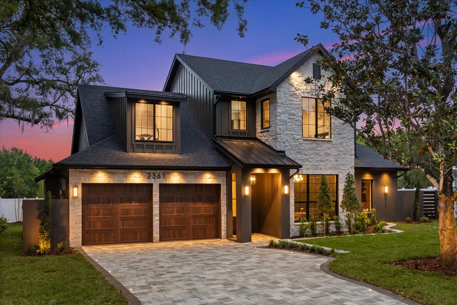 Newly completed and selected as a showcase residence in the 2026 Parade of Homes, Casa Noir is a custom-built statement home located within one of Winter Park's most desirable pockets and zoned for Audubon Park K-8. From the moment of arrival, the home's striking blend of natural stone, warm white oak, rich textures, and beautifully composed architectural lines creates an unforgettable first impression.

Step inside and you're immediately greeted by soaring ceilings, exposed oak beams, wide-plank white oak flooring, and expansive walls of glass that fill the home with natural light. The great room serves as the heart of the residence, anchored by a floor-to-ceiling natural stone fireplace with illuminated built-ins and expansive sliders that seamlessly connect indoor and outdoor living.

At the center of the home, you'll find a beautifully executed kitchen designed for both entertaining and everyday living, featuring floor-to-ceiling custom white oak cabinetry, designer stone surfaces, a substantial center island, illuminated wine display, a 48-inch gas range, and abundant storage. Nearby, a walk-in pantry, fully built-out laundry room, and mudroom enhance functionality while maintaining the home's refined design language.

Privately positioned on the main level, the dedicated office provides an inspiring setting for work, study, or creativity, while the primary suite serves as a true retreat. The spa-inspired bath is finished with floating oak vanities, rich stone surfaces, a freestanding soaking tub, and an expansive wet room that feels more like a luxurious resort. It's the kind of retreat you'll appreciate every morning and look forward to returning to at the end of each day.

Upstairs, a versatile loft creates the perfect setting for a media room, playroom, study space, or secondary gathering area. One bedroom enjoys the privacy of its own ensuite bath and walk-in closet, while two additional bedrooms are connected by a beautifully appointed Jack-and-Jill bath.

Step outside and you'll find yourself lingering a little longer than planned. A custom PebbleTec pool, covered tongue-and-groove lanai, fully integrated outdoor kitchen, and private backyard setting create an environment designed for effortless entertaining and low-maintenance enjoyment.

Built by Structure Redevelopment, a boutique builder known for delivering thoughtfully crafted custom residences throughout Central Florida.

Just minutes from Park Avenue, Rollins College, East End Market, Audubon Park, and Downtown Orlando, Casa Noir brings together exceptional architecture, thoughtful design, and everyday livability in one of Winter Park's most desirable locations - Schedule your tour today.