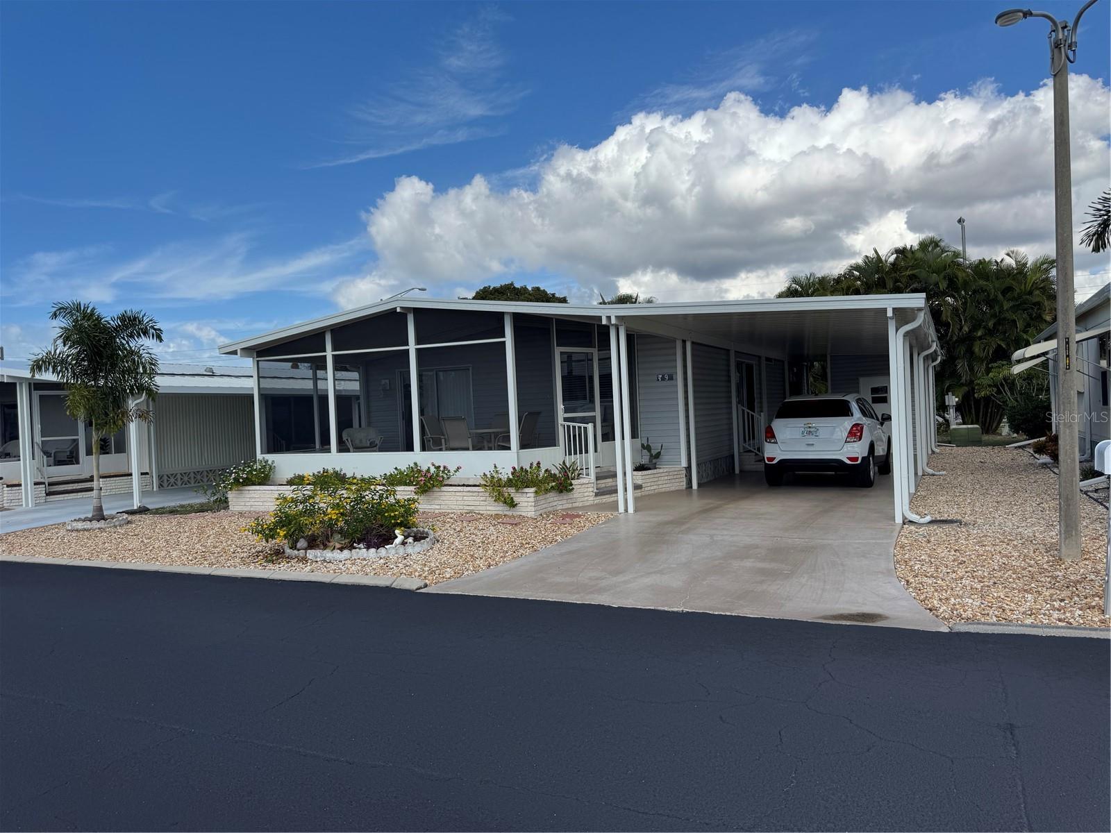 Enjoy the perfect blend of comfort and coastal charm at 9 Lafitte Drive in Nokomis! This beautifully maintained furnished water access neighborhood offers direct access to Shakett Creek with a neighborhood dock, ideal for boating, kayaking, or simply relaxing by the water. The open layout features light-filled living spaces, tasteful furnishings, and spacious Florida room (apex. 200 square feet) designed for entertaining or unwinding with peaceful quiet nights. Large Primary Bedroom has a walk-in closet. Very large laundry room conveniently located right off the driveway in the shed and under the carport for easy access. New electrical panel outside and new GFI's inside the home.  Located just minutes from Nokomis Beach, Venice Island, shopping, dining, and easy access to both I-75 and US-41, this home delivers the best of Florida’s laid-back lifestyle with move-in-ready ease.