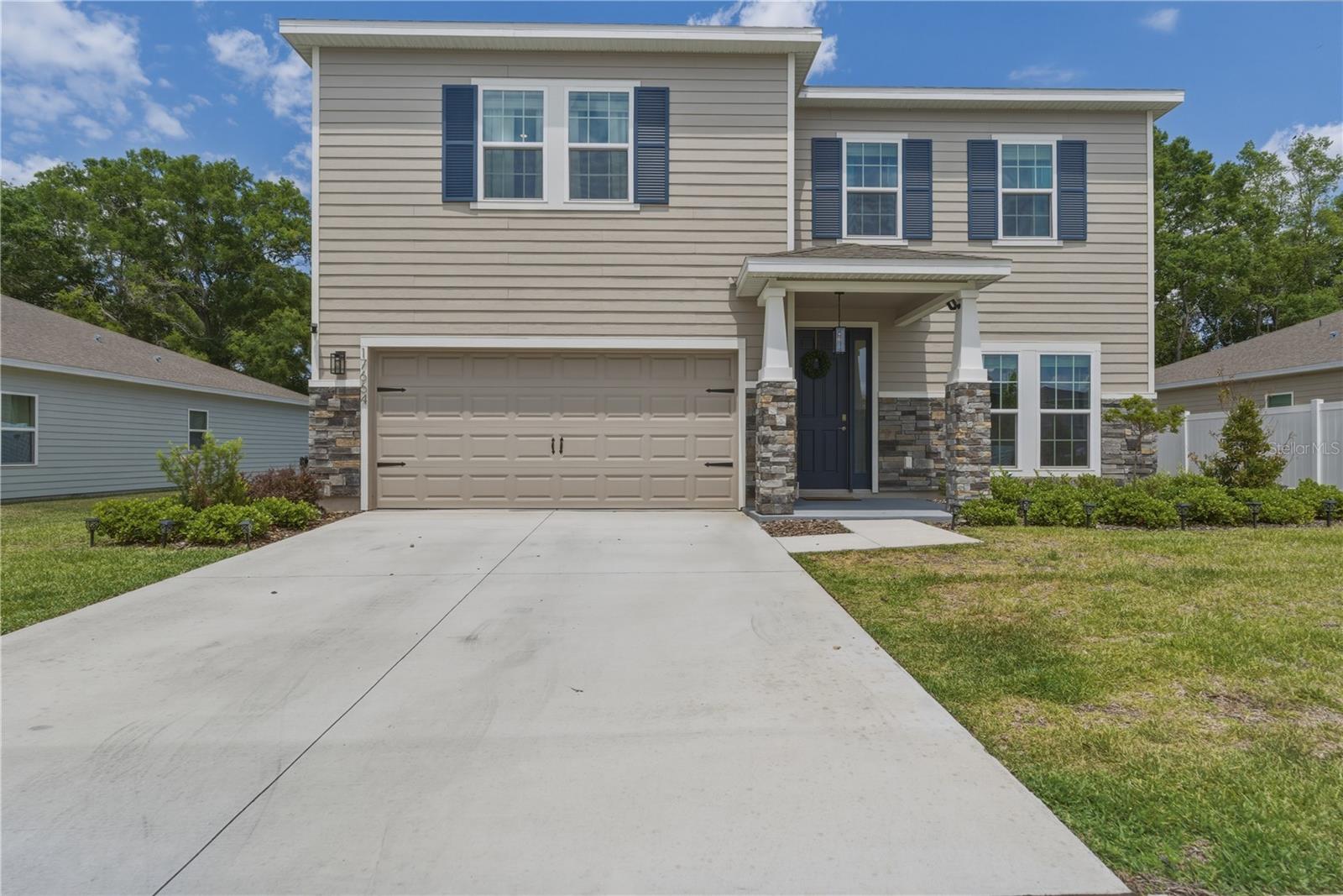 Come to see this newly build 2025 upgrades exquisite home filled with upgrades that highlight every corner of this espectacular home.  It features 4 bedrooms, 1 flex room, 3 bathrooms, large pantry space, two living rooms and a lot of space to spread around and enjoy.  The upgrades have been: no carpet in the first floor, bathrooms have been upgraded, enclosed lanai,  fully fenced in to have your furry friends run about, all lighting has been upgraded with gold features, beautiful backsplash was installed in the kitchen, accent walls installed and many more.  As soon as you come in you will fall in love with this magnificient home.  It is located just 3 minutes from I-75 making it an easy commute to Gainesville, Ocala and nearby cities.  It is minutes from famous restaurants and shopping centers and very close to Ginnie Springs, Poe Springs and several other Springs that are highly seeked treasures unique to this part of Florida.