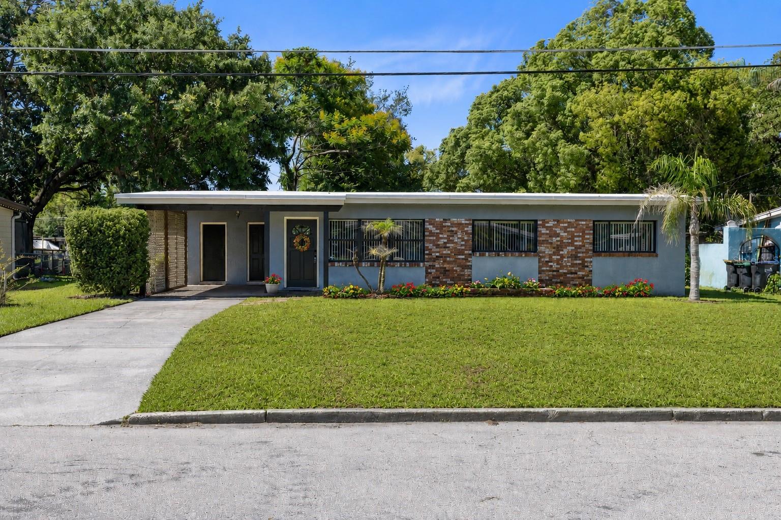Virtually Staged. Welcome to 1408 Watts Avenue, a charming and move-in-ready mid-century Florida home nestled on an oversized lot in one of Orlando’s most beloved lakefront communities, just moments from Belle Isle. Offering over 1,000 square feet of living space, this well-maintained block construction home features 3 bedrooms and 1.5 bathrooms that function as two separate bathrooms for added convenience. Inside, you'll find durable vinyl flooring throughout, no carpet, a bright and inviting layout, a new refrigerator, upgraded electrical, and a level of care that truly reflects pride of ownership. The fully fenced backyard provides exceptional outdoor space with plenty of room to play, garden, entertain, or store your toys, while two storage sheds and a covered carport add everyday practicality. With NO HOA restrictions, you'll enjoy the freedom to make the property your own. Residents love the neighborhood's GOLF-CART-FRIENDLY atmosphere and strong sense of community, with easy access to the Chain of Five Lakes, multiple nearby BOAT RAMPS, parks, community events, seasonal fireworks displays, holiday parades, Movies in the Park, and the highly regarded Cornerstone Charter School nearby. Combining classic Florida charm, modern updates, an incredible lot, and a location that offers the best of both Orlando and Belle Isle living, this property is the perfect place to call home.