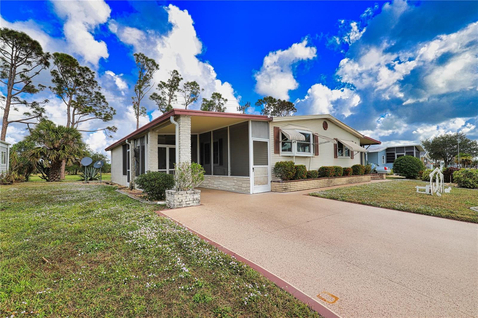 This charming home with stunning landscaping is nestled against 40 acres of untouched land in a vibrant 55+ community.  This home features a custom-made wheelchair ramp for easy accessibility from the driveway through the spacious lanai and into the home.  The kitchen / dining room / living room combination open to a large Florida Room that is under air and is perfect for entertaining friends and family.  There are wood beams on the ceiling and luxury vinyl throughout for added touches.  Both bedrooms and bathrooms are substantial in size with the washer/dryer located in the guest closet for added convenience.  This is a must-see and is located in the pet area so your furry friend will enjoy paradise too!  This is the perfect house to update, make your own, and live the Florida dream!  New roof 2022.  
La Casa boasts 974 homes nestled among a variety of native trees with spacious common grounds surrounding our eight lakes. Our lots average a generous 60' by 80'. The ultimate lifestyle on Florida’s Gulf Coast is located between Sarasota and Fort Myers and is a boater's dream with access to the Gulf of Mexico. It is convenient for shopping, sightseeing, golfing, fishing, and boating, as well as all the culture and elegance the Southwest Florida area is noted for. Residents and visitors enjoy the warmth of Southwest Florida winters in a relaxed and unhurried environment far removed from the hustle of Florida’s east coast. You’ll be surrounded by mature lush landscaping which demonstrates the utmost level of care our property receives from residents and management. La Casa may have the best pools in the area. Our crown jewel is an extremely large, 40 X 60-foot swimming pool that is kept at a perfect 87 degrees. Our smaller 20 x 40 pool is quietly nestled between the clubhouse and the Activity Building. Both pools have adjacent hot tubs which are ideal for soaking muscles that are tired from golfing or tennis. Wireless Internet (Wi-Fi) is available at the Clubhouse, Activity Building, and Recreation Hall area where these pools & spas are located, so you can catch some rays while you catch up on your email! Sound enticing? La Casa is a friendly, family community. You will be away from the hustle and bustle except when you want to be part of it. Come for a visit to this self-contained oasis and see for yourself why La Casa is the ultimate destination for both snowbirds and year-round residents!