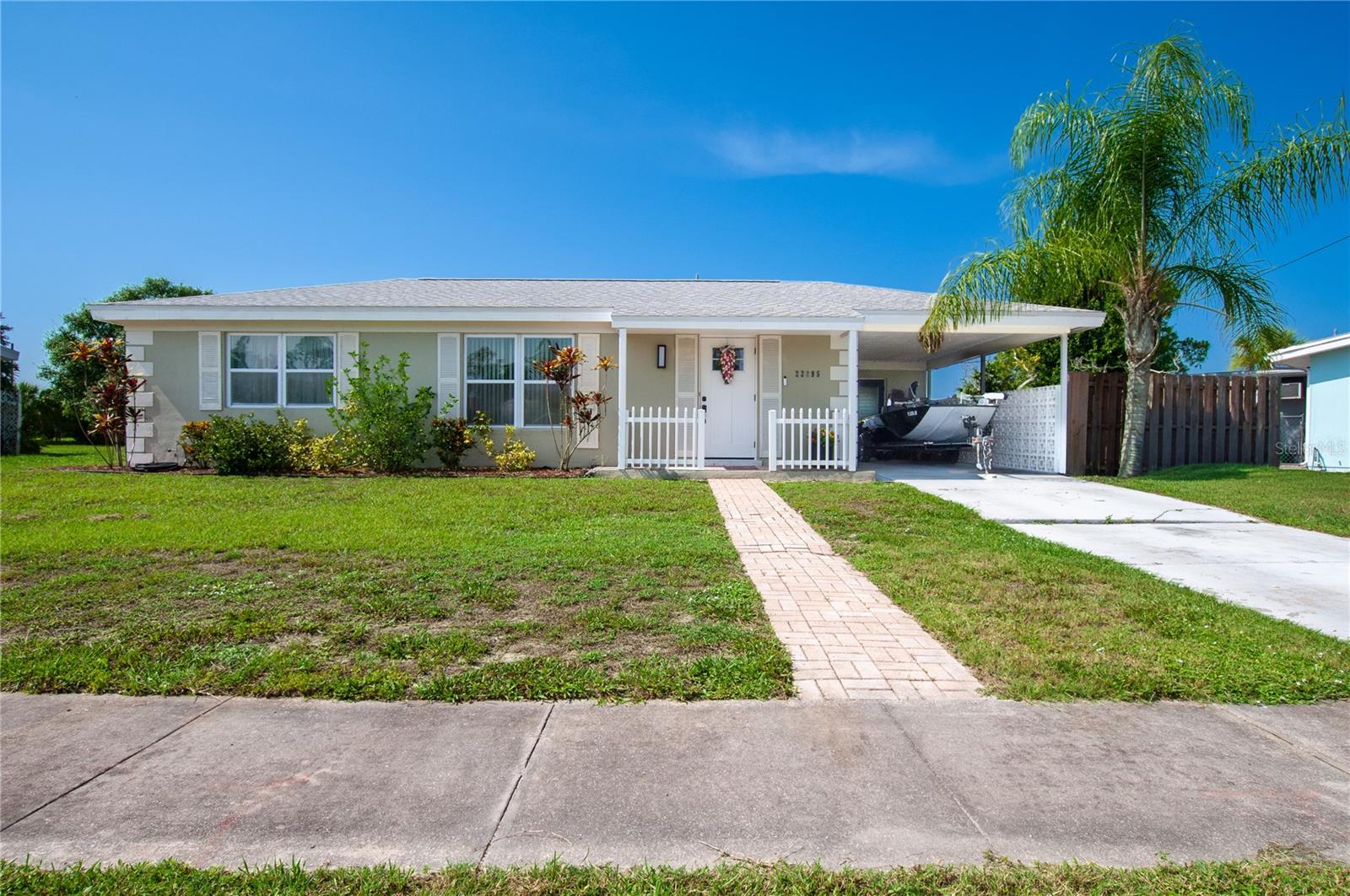 Welcome to this beautifully updated home offering over 1,000 square feet of comfortable living space in the heart of Port Charlotte! This charming residence features a remodeled kitchen with modern finishes, making it the perfect place to cook, gather, and entertain.

Offering 2 bedrooms, 1 bathroom, and a versatile bonus room, this home provides flexible space for a home office, playroom, den, or guest room to fit your lifestyle.

Outside, you'll appreciate the convenience of the attached carport and the fully privacy-fenced backyard, creating the perfect space for pets, outdoor entertaining, gardening, or simply relaxing in your own private oasis.

Connected to city water and sewer, this move-in-ready home offers both comfort and convenience. Ideally located near shopping, dining, schools, parks, medical facilities, and Charlotte Harbor, this property is perfect for first-time homebuyers, seasonal residents, or anyone looking to enjoy the Florida lifestyle.

Don't miss your opportunity to make this charming Port Charlotte home your own! Schedule your private showing today!