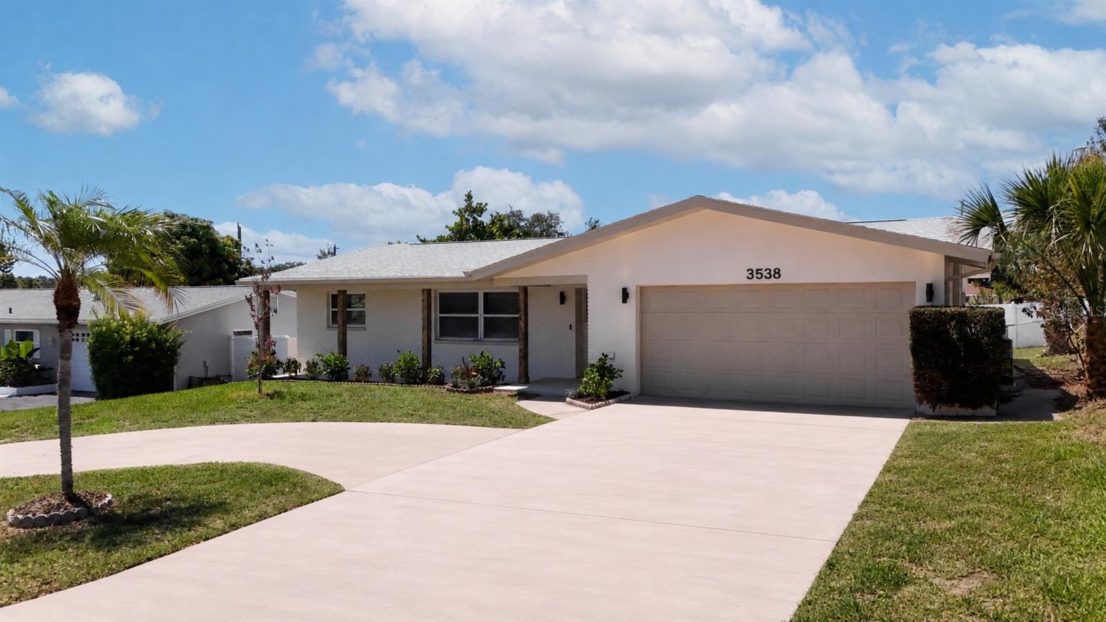 Welcome to 3538 Shady Bluffs Drive in Largo, Florida—a beautifully remodeled 4-bedroom, 2-bathroom home offering all the modern upgrades, energy efficiency, and Florida outdoor living at its finest.  This move-in-ready residence has been extensively updated throughout, featuring a stunning new kitchen with quartz countertops, new appliances and designer inspired finishes. Luxury Vinyl floors are throughout the home giving an elegant look and long term durability.  Both bathrooms have been completely renovated with stylish fixtures and modern design elements. Newer double pane windows provide peace of mind while enhancing energy efficiency and natural light.  Step outside to your private backyard oasis, complete with an in-ground swimming pool—perfect for entertaining, relaxing, and enjoying the Florida lifestyle year-round. Additional major improvements include a newer roof (2018), a brand-new HVAC system (2025), and a fully paid-off solar system that helps keep utility costs low.  The home also features a spacious 2-car garage, generous living areas, and a desirable location in Flood Zone X, offering added confidence and potential savings on insurance costs.  Conveniently located near beaches, parks, shopping, dining, and top-rated amenities, this exceptional property combines modern comfort, quality upgrades, and outstanding value.  Don't miss the opportunity to make this beautifully updated Largo home your own.
