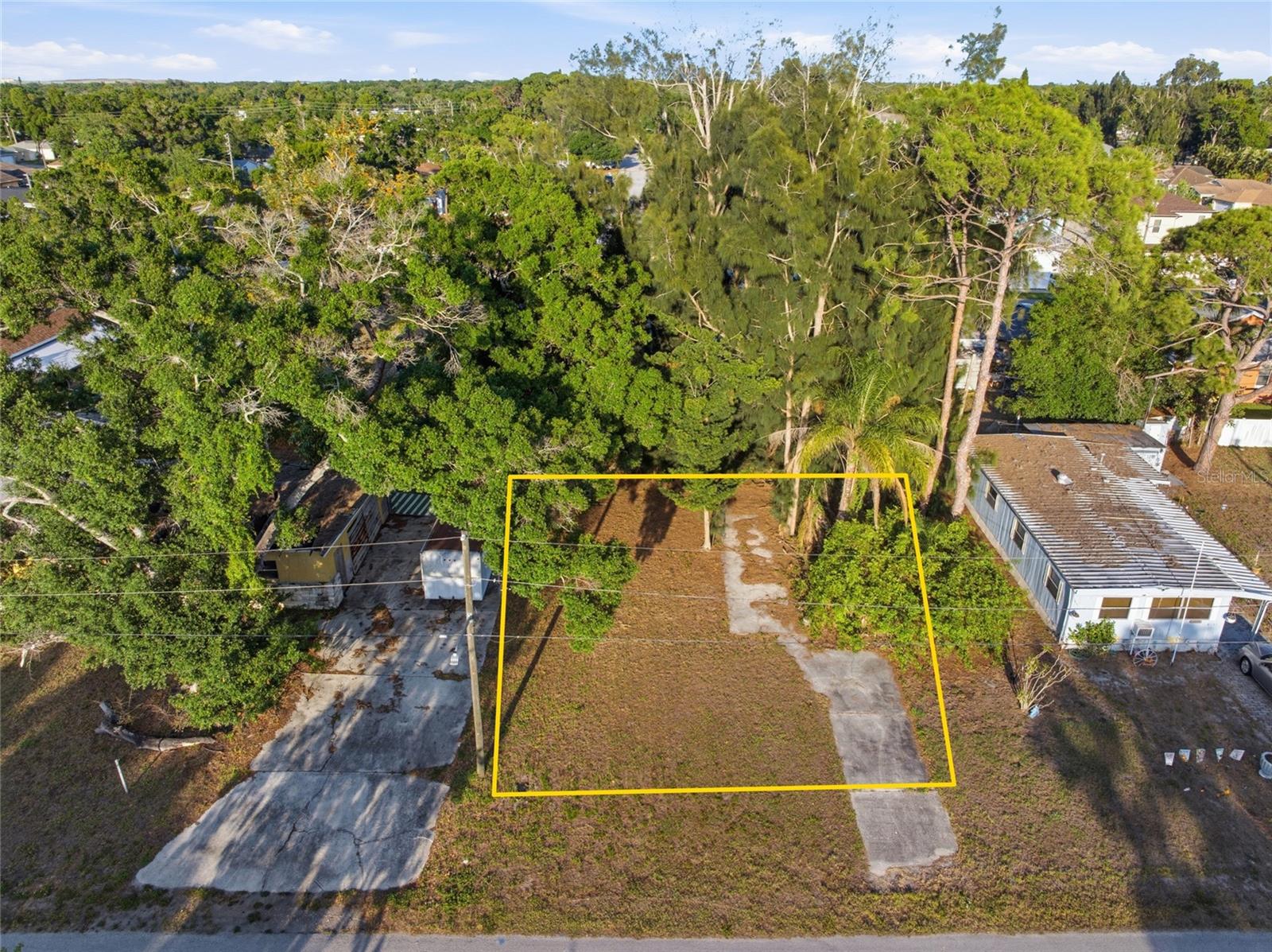 Build-Ready Vacant Lot – 60' x 90'. Excellent opportunity to own a cleared, build-ready lot measuring 60' x 90' with electric, water, and sewer utilities available. The property also features an existing driveway and parking pad. Whether you're planning a primary residence, investment property, or spec home, this lot is ready for your vision. For builders and investors, an adjacent double lot is also available separately (MLS #TB8520980), creating a rare opportunity to acquire three side-by-side homesites. Purchasing the neighboring double lot parcel together can provide significant savings through streamlined site development, utility connections, construction logistics, and overall project efficiency. With convenient access for construction and the flexibility of multiple contiguous lots, this property offers outstanding potential for both individual buyers and builders looking to maximize value. Property Highlights: Cleared and ready to build; 60' x 90' lot;
Electric, water, and sewer available; Existing driveway and parking pad; Adjacent double lot available for purchase; Potential for three side-by-side homesites; Ideal for builders, investors, or homeowners; Opportunity for development and construction cost savings. Don't miss this chance to secure a ready-to-build lot with expansion potential and existing site improvements already in place.