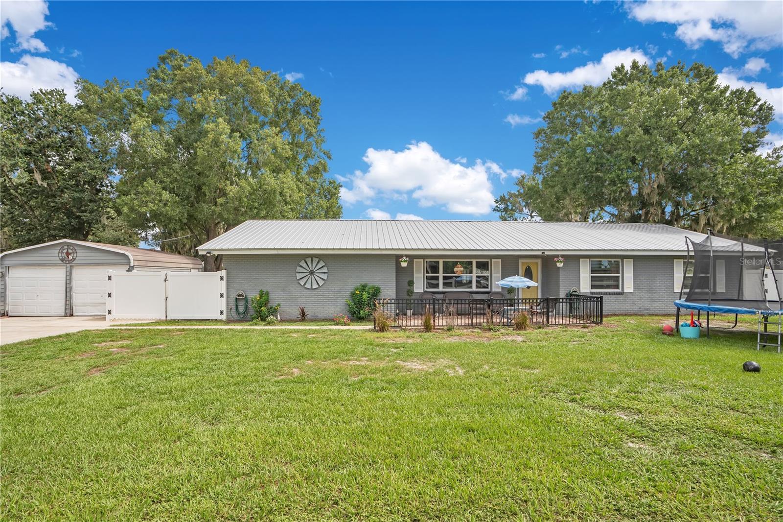 MOTIVATED SELLER!! USDA ELIGIBLE!!  Welcome to this thoughtfully updated home offering 3 bedrooms, 2 bathrooms, plus a converted garage that provides two additional bedrooms—perfect for a growing family, guests, a home office, or flexible living space.

Step outside and enjoy the outdoor kitchen setup, creating the ideal space for entertaining, weekend cookouts, and enjoying Florida living year-round.

This home has been well maintained with numerous major updates, including a new aluminum roof (2019), hurricane-impact windows (2020), and a new A/C system (2022) for added comfort and peace of mind. The PVC privacy fence (2017) provides a secure, private backyard, while the home’s plumbing was completely replaced in 2011, along with updated cabinetry, offering both style and long-term reliability.

With generous living space, significant upgrades, and an outdoor entertaining area, this home is move-in ready and offers exceptional value. Schedule your private showing today!