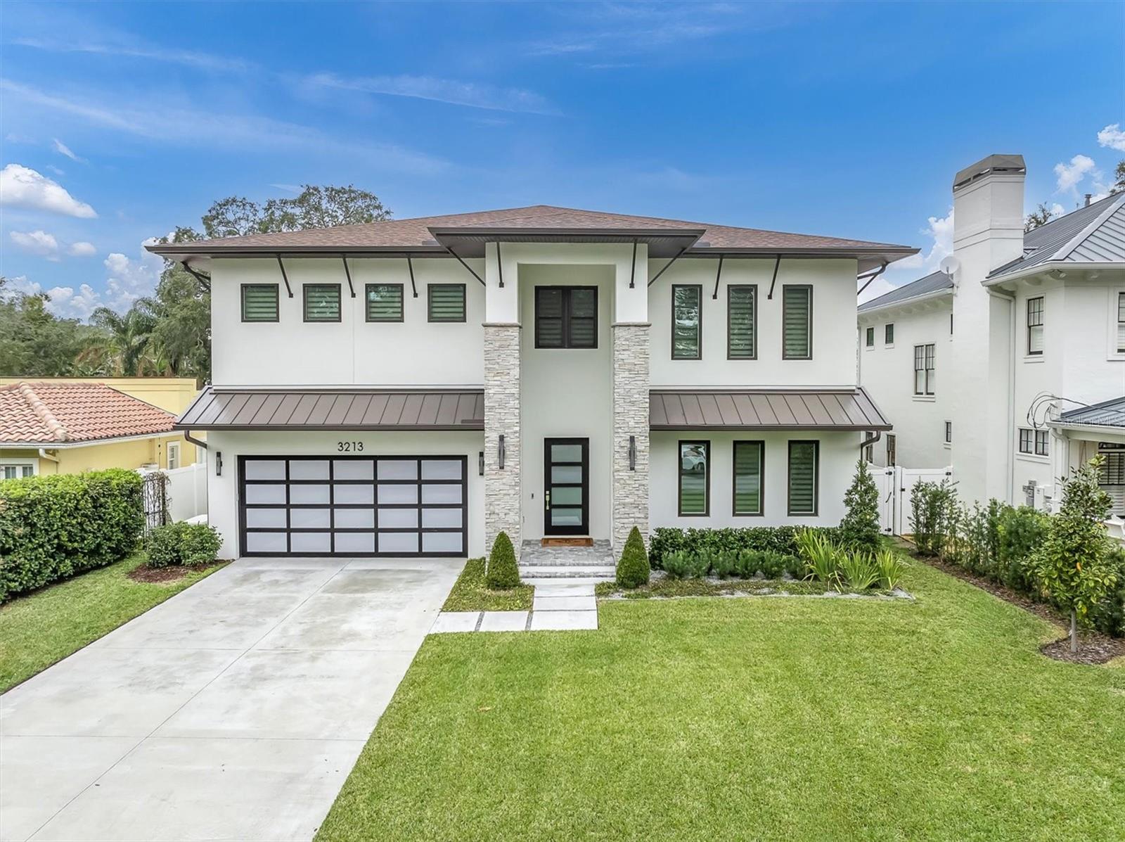 Discover the perfect blend of modern elegance and coastal charm in this custom-built luxurious coastal contemporary home located on a deep lot in quiet, picturesque neighborhood of Bayshore Beautiful. No Flood insurance required, located in a high and dry area. Full whole house generator for peace of mind. Thoughtfully designed with style, functionality, and entertaining in mind. Furniture optional. Experience the open floor plan starting with an expansive Great room that seamlessly connects to a gourmet kitchen and with a stunning designer dry bar that features two wine refrigerators. The cook in your home will appreciate this Gourmet Kitchen featuring quartz countertops, Sub-Zero and Wolf appliances, gas cooktop, ample storage, and a large pantry, perfect for culinary creations. Working from home or private den offers flexible living spaces. First floor spacious guest ensuite.  Primary Suite Retreat, located on the second floor with a tremendous walk-in closet and luxurious ensuite bath. 3 additional bedrooms, all ensuite , with walk in closets. Convenient Second-Floor Laundry, perfectly situated near bedrooms for added ease. Bonus Room on 2nd floor becomes a versatile 22’ x 14’ space, ideal for a game room or media center. Your Outdoor Oasis is complete with pavers, covered lanai equipped with a built-in outdoor kitchen, gas grill, beverage fridge designed for casual entertaining and alfresco dining. Saltwater Pool & Spa: Relax and unwind in your private backyard retreat. Large Fenced Yard: Plenty of space for outdoor activities, pets, or simply enjoying the serene surroundings. Frosted impact glass door to Three-Car Garage with epoxy floors offers ample parking & storage, tankless gas water heater and irrigation system. This home is an entertainer’s dream and a haven for modern living!