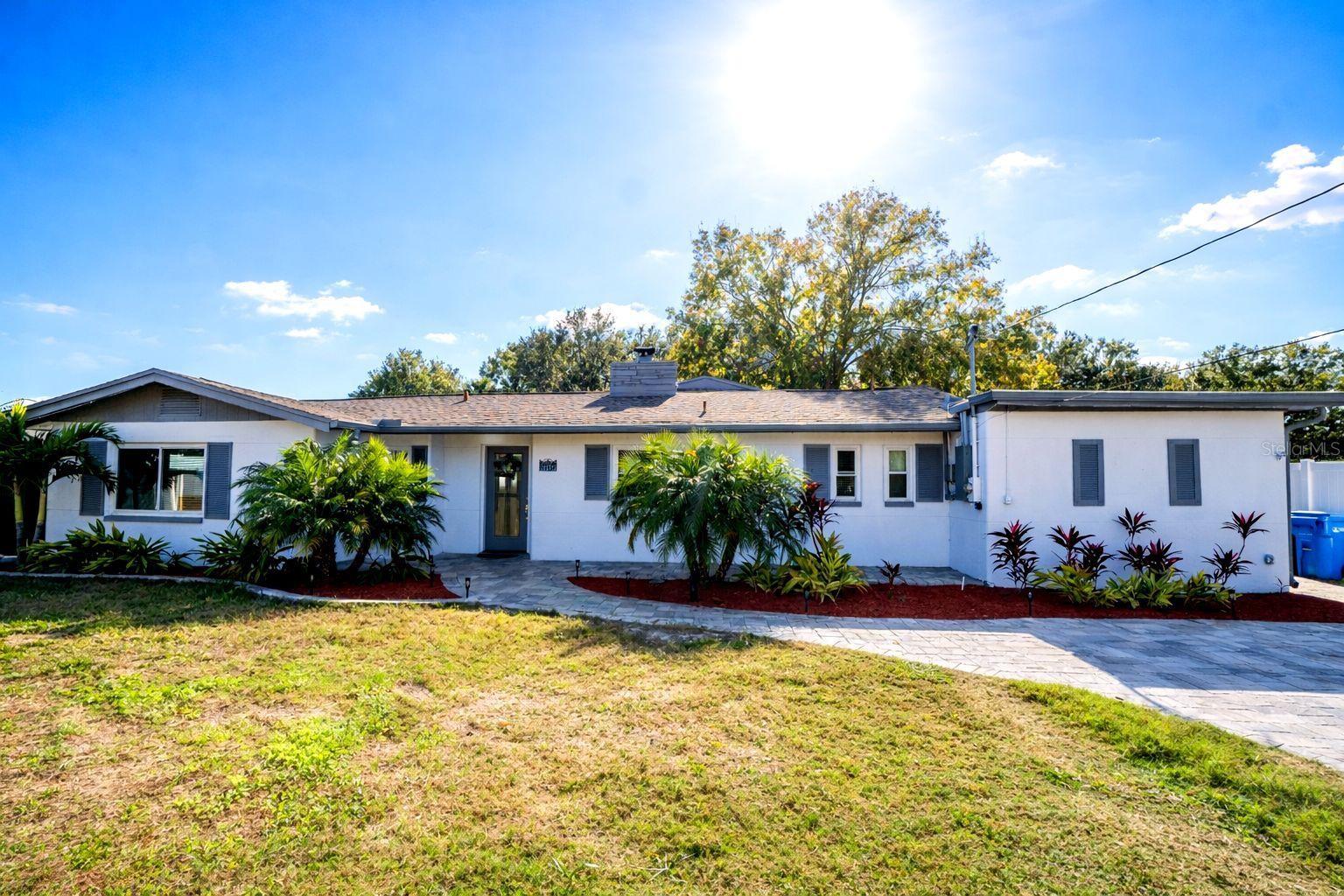STUNNING, FULLY REMODELED HOME WITH EXTRA INCOME POTENTIAL IN TAMPA! Welcome to this spectacular, fully renovated property situated right on the beautiful, serene Bellos Lake. If you are looking for a modern, move-in-ready home featuring luxury finishes, versatile living spaces, and a waterfront lifestyle, this is the perfect opportunity!
The main house welcomes you with an open-concept layout bathed in natural light and enhanced by beautiful, brand-new vinyl flooring that blends elegance with high durability. The living area features a cozy fireplace, perfect for creating unforgettable family moments. The kitchen is completely new, equipped with modern finishes, contemporary cabinetry, and premium countertops. Additionally, the bathrooms have been renovated from the ground up with a elegant, up-to-date design.
A WATER LOVER'S PARADISE! Living at Bellos Lake allows you to fully enjoy water activities right from your backyard. Spend your days kayaking, jet-skiing, or boating. Best of all, the spacious lot offers the incredible opportunity to build your own private boat dock.
HIGHLY VERSATILE ADDITIONAL SPACES:
The property features two independent areas ideal for in-law suites, teen suites, home offices, or rental income:
1. Attached Studio: An integrated space with its own entrance, featuring a bedroom, full bathroom, and kitchen area.
2. Detached Backyard Studio: A separate structure with its own bedroom, full bathroom, and kitchen—perfect for complete privacy.
Excellent Tampa location with quick access to highways, shopping, dining, and entertainment. Schedule your visit today and fall in love with your next dream home by the lake!