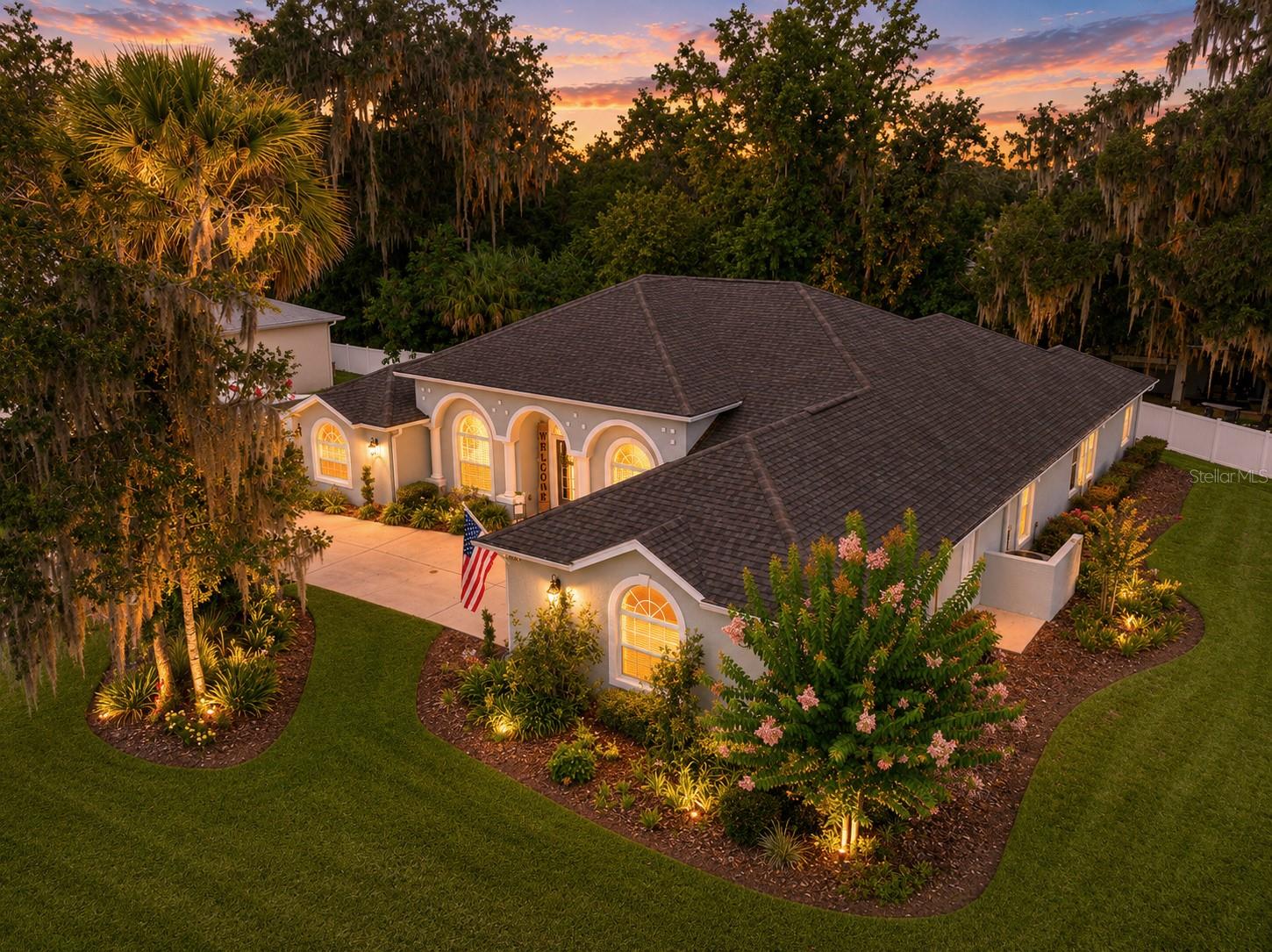 Welcome to one of Ocala's most desirable hidden enclaves- WHITE OAK VILLAGE. Perfectly positioned on a premier corner homesite among distinguished luxury residences, this exceptional 4- bedroom, 3 bath home with a dedicated flex room offers timeless elegance and everyday comfort.
Designed with both entertaining and modern living in mind, the home showcases rich hardwood flooring, designer tile, granite countertops, premium stainless steel appliances, plantation shutters throughout, and a spacious interior filled with natural light.  The versatile flex room is ideal for a private executive office, fitness studio, or media room.
The inviting living area is anchored by a beautiful fireplace, creating the perfect setting for intimate evenings or elegant gatherings.  A tankless water heater provides endless hot water, while the brand-new 2025 roof and 2020 HVAC offer peace of mind for years to come. 
Located just minutes from Ocala's premier medical facilities, downtown dining, shopping, and equestrian venues, this residence offers an exceptional blend of luxury, convenience, and prestige in one of the city's most sought-after neighborhoods.
A RARE OPPORTUNITY TO OWN IN A COMMUNITY WHERE HOMES SELDOM BECOME AVAILABLE.