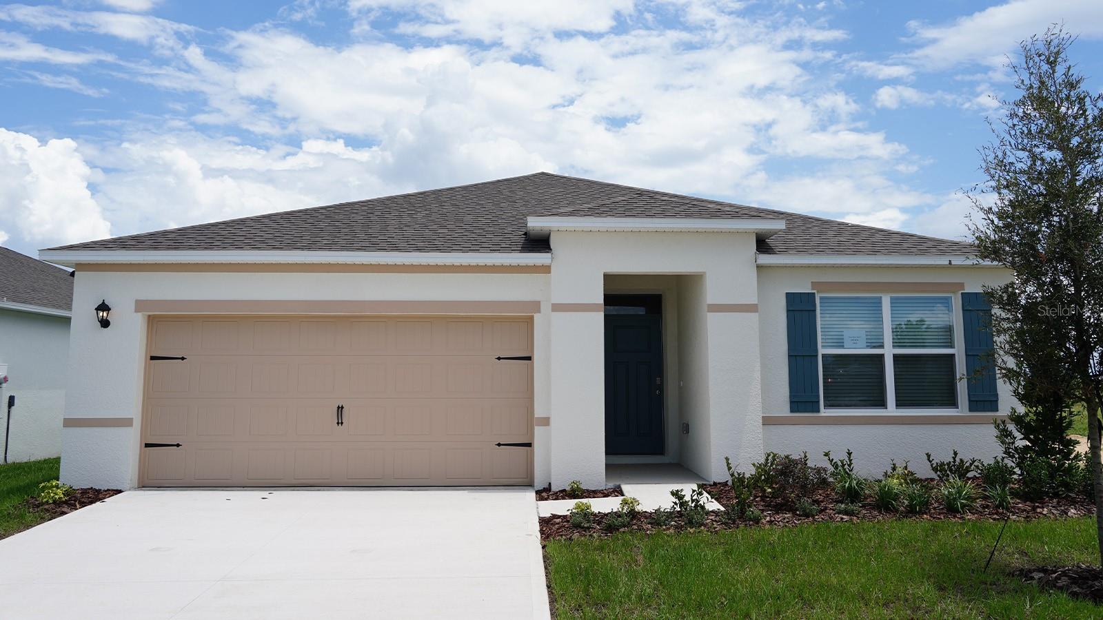 Under Construction. The Aria is one of our one-story floorplans featured in Hamilton Bluff in Haines City, Florida. With multiple exteriors to choose from, the Aria is a popular home.

Inside this 3-bedroom, 2-bathroom home, you’ll find 1,672 square feet of comfortable living. This all-concrete block constructed, one-story layout optimizes living space with an open concept kitchen overlooking the living area, dining room, and covered lanai.

Entertaining is a breeze, as this popular single-family home features a living and dining in the heart of the home, with covered lanai just steps away in your backyard. The spacious kitchen features stainless steel appliances, a convenient island, and walk-in pantry with ample storage.

In every bedroom you’ll have carpeted floors and a closet in each room. Whether these rooms become bedrooms, office spaces, or other bonus rooms, there is sure to be comfort.

The primary bedroom located in the rear of the home has its own attached bathroom that features a walk-in closet and all the space you need to get ready in the morning. Sharing a sink isn’t a worry with the double vanity. Two additional bedrooms share a second bathroom. This home also features a nice laundry room space with privacy doors and a two-car garage for parking or storage.

Like all homes in Hamilton Bluff, the Aria includes smart home technology, which allows you to control your home anytime with your smart device while near or away.

Contact us today and find your home at Hamilton Bluff.

*Photos are of similar model but not that of the exact house. Pictures, photographs, colors, features, and sizes are for illustration purposes only and will vary from the homes as built. Home and community information including pricing, included features, terms, availability, and amenities are subject to change and prior sale at any time without notice or obligation. Please note that no representations or warranties are made regarding school districts or school assignments; you should conduct your own investigation regarding current and future schools and school boundaries.*