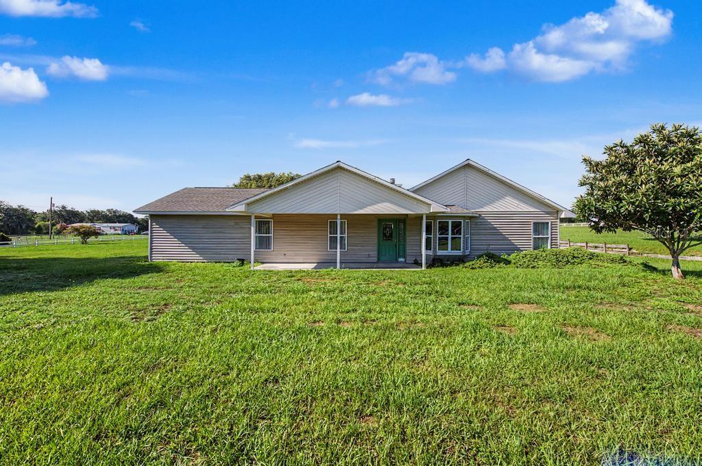 Virtually Staged. Welcome to peaceful country living at 39628 Otis Allen Rd! Nestled on over 2 fully fenced acres, this 3-bedroom, 2.5-bathroom home offers the perfect blend of privacy, comfort, and endless possibilities—all just minutes from the Mirada Lagoon.
Inside, you'll find an expansive open floor plan with soaring vaulted ceilings, an oversized living room with a cozy fireplace, and a spacious kitchen featuring abundant cabinetry, a center island, and ample counter space—perfect for entertaining or everyday living. The split-bedroom layout provides added privacy, while the oversized primary suite features a walk-in closet and an en-suite bath with a soaking tub and separate walk-in shower.
Step outside to the covered back patio and enjoy peaceful views of your sprawling property, with plenty of room for horses, farm animals, recreational vehicles, a workshop, or future additions. Don't miss this rare opportunity to own your own private slice of paradise with room to live, grow, and play!