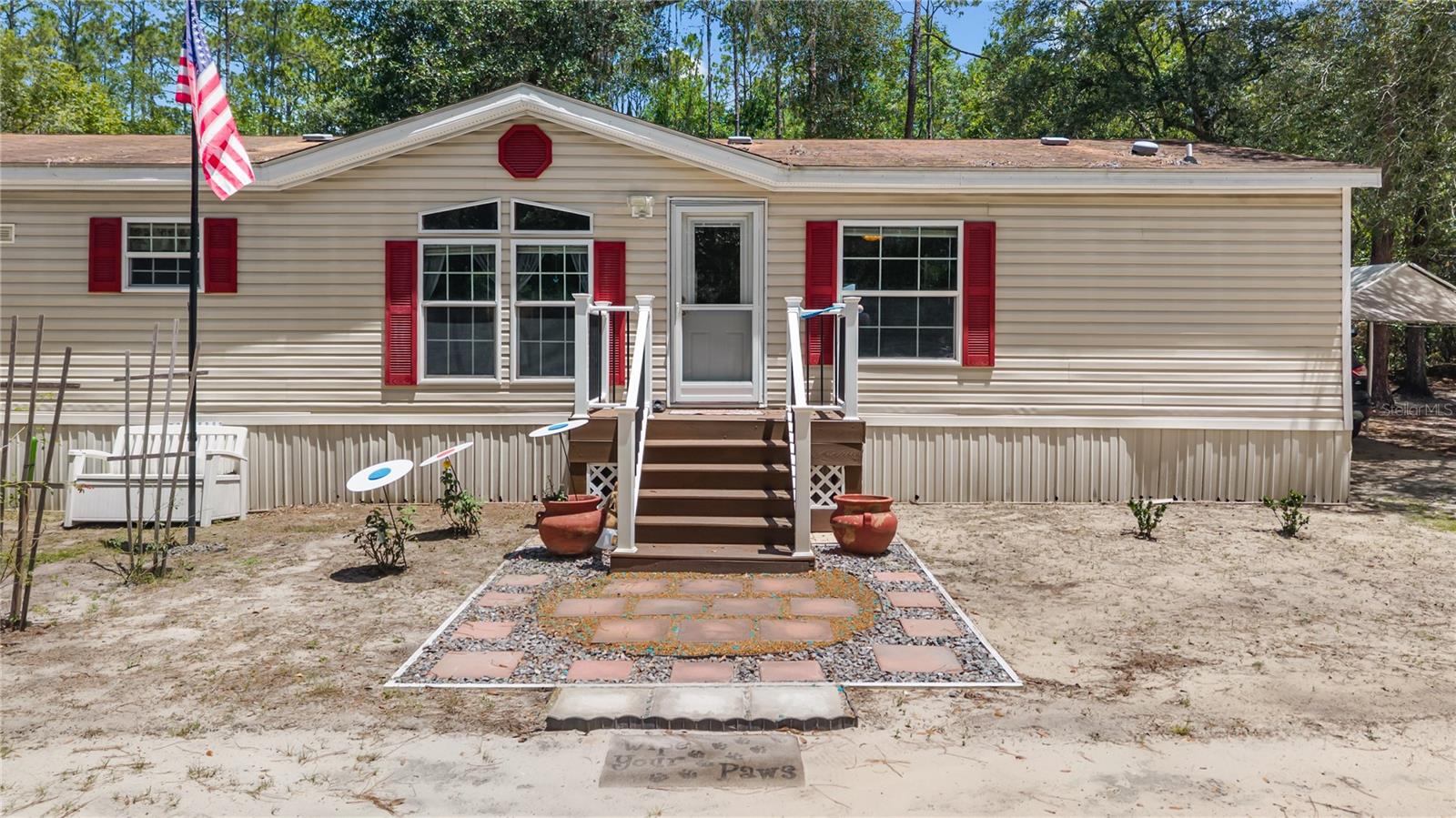 Tucked away on 3.41  acres of wooded seclusion, this 3 bed 3 bath home is the perfect escape. Enjoy a new deck, newer appliances, washer/dryer, and a tiled bathroom with garden tub. A water softener, motion lighting, and whole-property generator add comfort and peace of mind. Cool off in the above-ground pool, watch deer from your backyard nearly every evening, and take advantage of three sheds, one wired with electricity for a workshop or man cave. Accessibility ramp in the back of the house. Privacy, nature, and modern updates all in one. Roof is 10 years old, AC is 4 years old.
