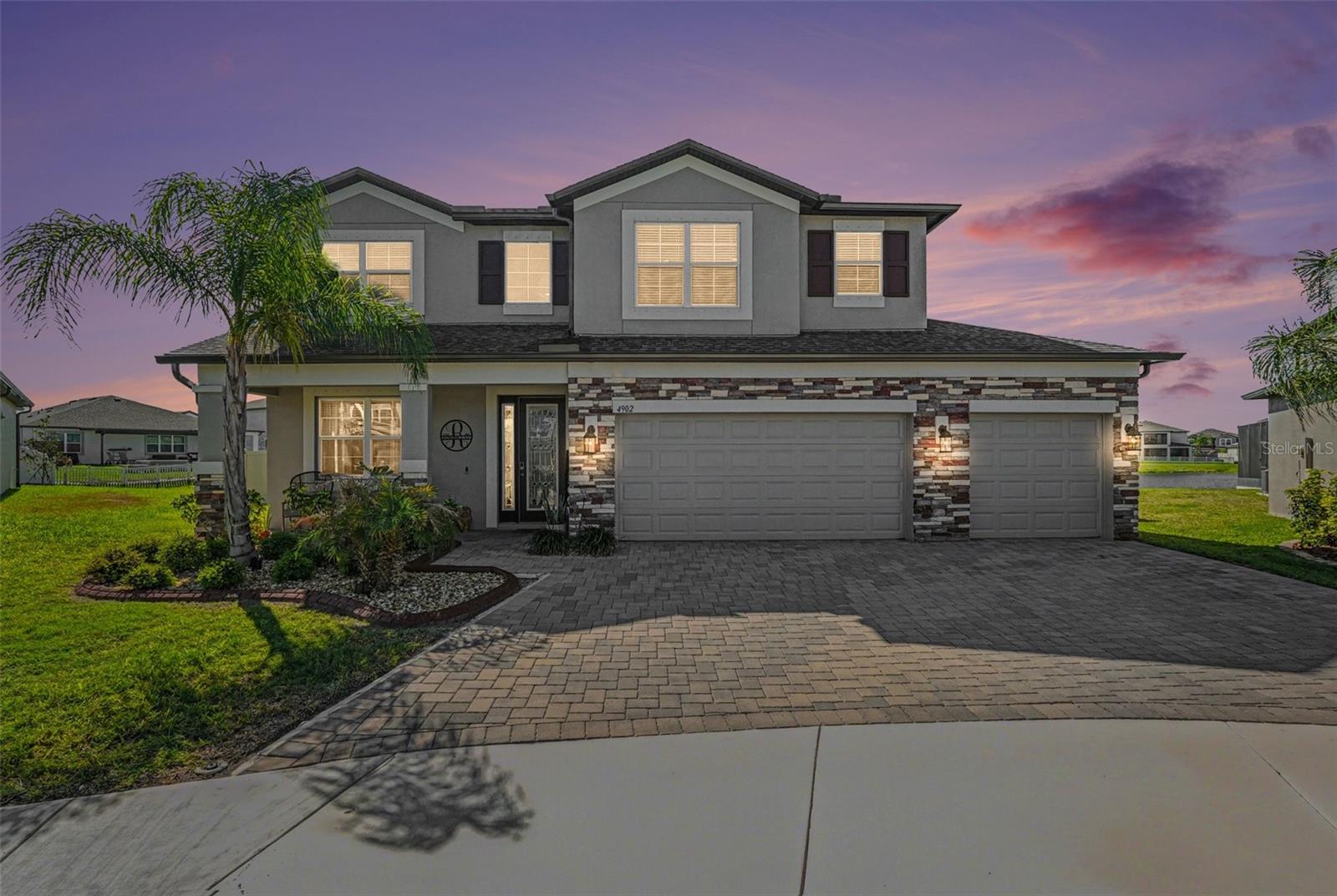 Why wait to build when you can own this like-new, fully upgraded 2024 Mira Lago by M/I Homes, perfectly positioned on a premium cul-de-sac lot with water views in the highly sought-after Berry Bay community?
This exceptional 5-bedroom, 4-bath, 3-car garage home offers an ideal blend of space, design, and upgrades, all maintained in impeccable condition.
A dramatic two-story foyer with iron railings, 10-foot ceilings, and 8-foot doors creates an open and elegant feel throughout the main level. The chef-inspired kitchen features quartz countertops, stainless steel appliances, a spacious island, walk-in pantry, and a butler’s pantry, rarely found in similar homes.
The main floor includes a private guest suite with full bath and an additional pool bathroom, ideal for multigenerational living or guests. Upstairs offers a spacious loft and a luxurious owner’s suite with tray ceiling, oversized walk-in closet, and private screened balcony with water views.
Enjoy an extended screened lanai (approx. 40’ x 20’) with over 800 sq ft of covered outdoor space, perfect for entertaining and future pool plans.
With over $60,000 in upgrades., including crown molding, ceiling fans throughout, custom blinds, epoxy garage floors, and enhanced landscaping, this home stands out from the rest.
Berry Bay offers resort-style amenities including a pool, pickleball and basketball courts, playground, and dog parks, all conveniently located near Tampa, St. Pete, Lakewood Ranch, and the beaches.
A rare opportunity to own a like-new, highly upgraded home in a prime location. Move-in ready homes like this are hard to find—schedule your private tour today.