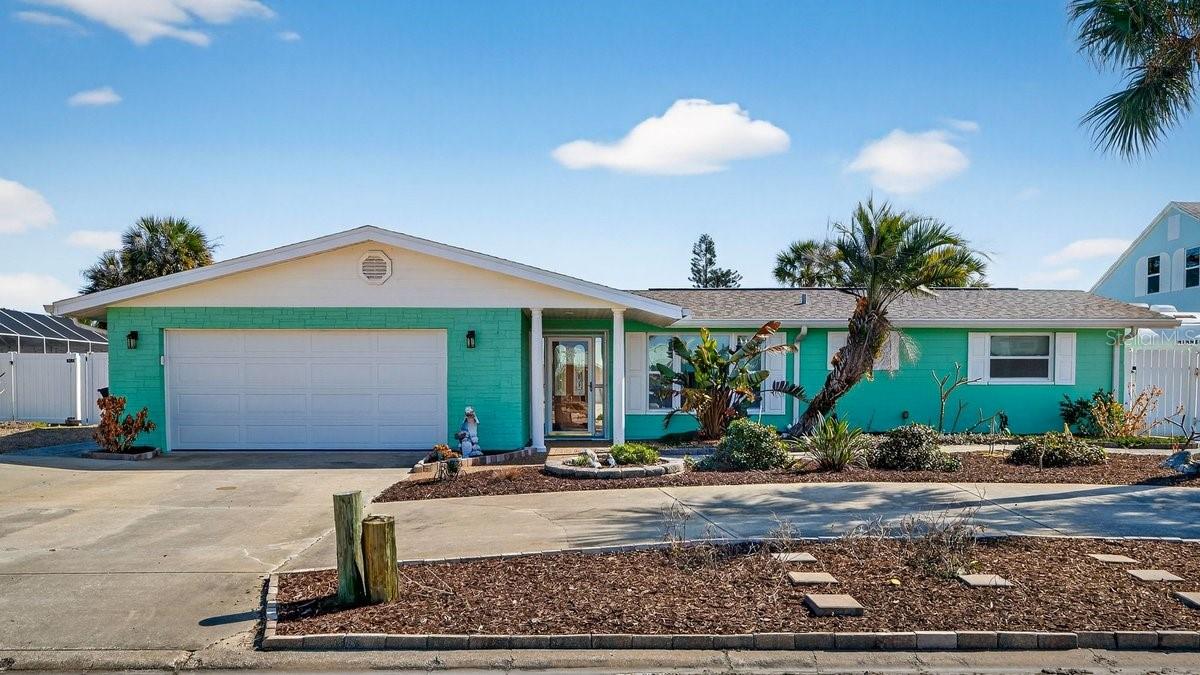 Live the ultimate coastal boating lifestyle in this beautifully maintained canal-front home in highly sought-after Ponce Inlet, offering direct boat access to the Intracoastal Waterway and Atlantic Ocean just north of the Ponce Inlet Jetty. Whether you're heading out for a sunset cruise, deep-sea fishing, or docking for dinner at local favorites like Off The Hook at Inlet Harbor or Down the Hatch, this location puts it all within easy reach by water or a quick drive. This waterfront property features a private boat lift, seawall, and no history of flooding, plus the added benefit of being on a police electrical line for reliable power stability.

Extensively improved and thoughtfully upgraded, this home blends peace of mind with modern comfort. Major investments include a new AC system (2023), roof (2018), Dovi impact windows and doors, Anderson sliding doors, French drain system, upgraded foundation work, hurricane shutters, insulated garage door, gutters, and Hardy board eave replacements. The remodeled kitchen showcases tile flooring and quality finishes, complemented by laminated wood flooring throughout main living areas. A saltwater pool and newly sealed pool deck create a private outdoor retreat, while exterior repairs, fresh paint, and the removal of the pool cage enhance both aesthetics and functionality.

Additional improvements such as a termite bond with Shell Pest, electrical upgrades, and a recently reinforced seawall demonstrate the care and investment poured into this property. If you're searching for a move-in-ready waterfront home with direct boating access, major system upgrades, and an unbeatable location near dining, marinas, and beaches, this Ponce Inlet gem delivers the full Florida coastal lifestyle.