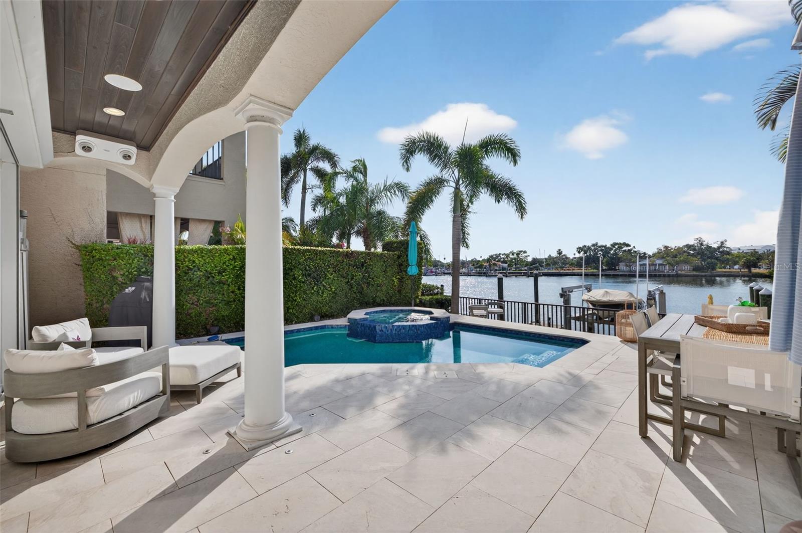 Discover the rare chance to own a luxury waterfront home within Harbour Island’s exclusive 24/7 guard-gated enclave. This fully transformed residence blends refined design with true resort-style living. Wide-plank hardwoods, polished marble, Restoration Hardware fixtures, artisan finishes, and a custom Sub-Zero bar elevate the interior ambiance. The Quartzolite kitchen with gas cooking and premium built-ins enhances both daily living and entertaining.
The home features a fully controlled smart-home system, allowing effortless management of lighting, climate, entertainment, and pool functions throughout the property. The primary suite lives like a private spa, offering heated marble floors, a ThermaSol steam shower, and an MTI hydrotherapy tub. Updated mechanical systems include dual A/C units installed in 2018, tankless water systems, an elevator, and a generator-ready electrical panel providing comfort, efficiency, and peace of mind. A new roof completed in 2024 further strengthens the home’s long-term integrity.
The outdoor living experience rivals a luxury resort: a vibrant pool and spa, resurfaced deck, updated lighting, surround sound, app-controlled systems, and deep-water canal frontage perfect for enjoying Tampa’s spectacular sunset views. Waterfront amenities include a 16,000-lb boat lift, mounted water-illuminating lighting, an artificial reef, and a refreshed dock.
A rare combination of elegance, privacy, security, modern technology, and sunset-facing waterfront living, just moments from Tampa’s top dining and entertainment destinations.