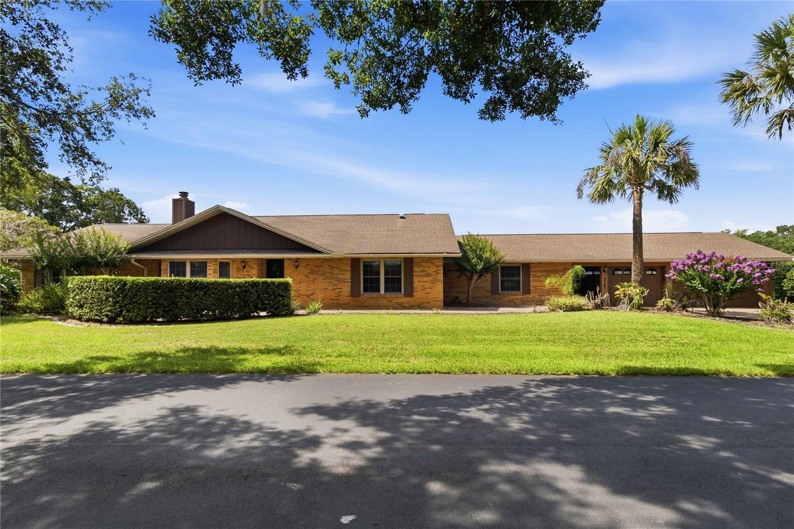 Tucked along the quiet edge of the East Toho chain, this stunning 4-bedroom, 3-bath waterfront retreat sits on over half an acre of lush, oak-canopied land with a private dock, canal access, and a multi-lake boating life waiting right outside your back door. At 2,804 square feet, there’s room here to breathe, to gather, and to finally exhale.

Step inside and you’ll feel it immediately — the vaulted great room draws you in with soaring ceilings and a gorgeous fireplace that anchors the space with warmth and character. The kitchen is the heart of this home in every sense: quartz surfaces, updated cabinetry, and a chef-worthy 60/40 oven and cooktop that makes cooking feel like a pleasure, not a chore. Every appliance conveys — move in and start living.

The split floor plan gives everyone their own corner of peace, and the fourth bedroom is something special — privately positioned with its own bath, multiple entrances, and French doors that open directly to the backyard. Whether it becomes a mother-in-law suite, a guest retreat, or a quiet home office, the flexibility is entirely yours.

And then there’s the enclosed patio — a true bonus living space with sliding doors, so you can fling them open to the breeze or close them in and enjoy the view year-round. It flows seamlessly from the main living area and sets the tone for everything just beyond: the screened pool, the private dock, private sun deck and the water views.  Every Sunday gathering, every lazy afternoon, every golden Florida evening has a home here. The canal connects you to Lake Ajay, Fells Cove, Lake Runnymede, Boggy Creek, and East Lake Toho — all just a short boat ride away. The community boat ramp at the end of the canal makes it effortless. Canal-fed irrigation keeps the lawn green without the water bill.

Paver driveway. Oversized 3-car garage. Walk-in closets. Enormous attic. And yes — all of this with a septic system, low HOA, and the kind of lower-tax, laid-back living that feels increasingly rare. You’re practically in the heart of Lake Nona — but you’re in the country. One mile from Publix. Three from Walmart and Sam’s. Four from the 417. Multiple Access points to get anywhere without hassle.

The magnificent grandfather oaks have been here for generations. Now it’s your turn.

Available furnished — just ask for details.