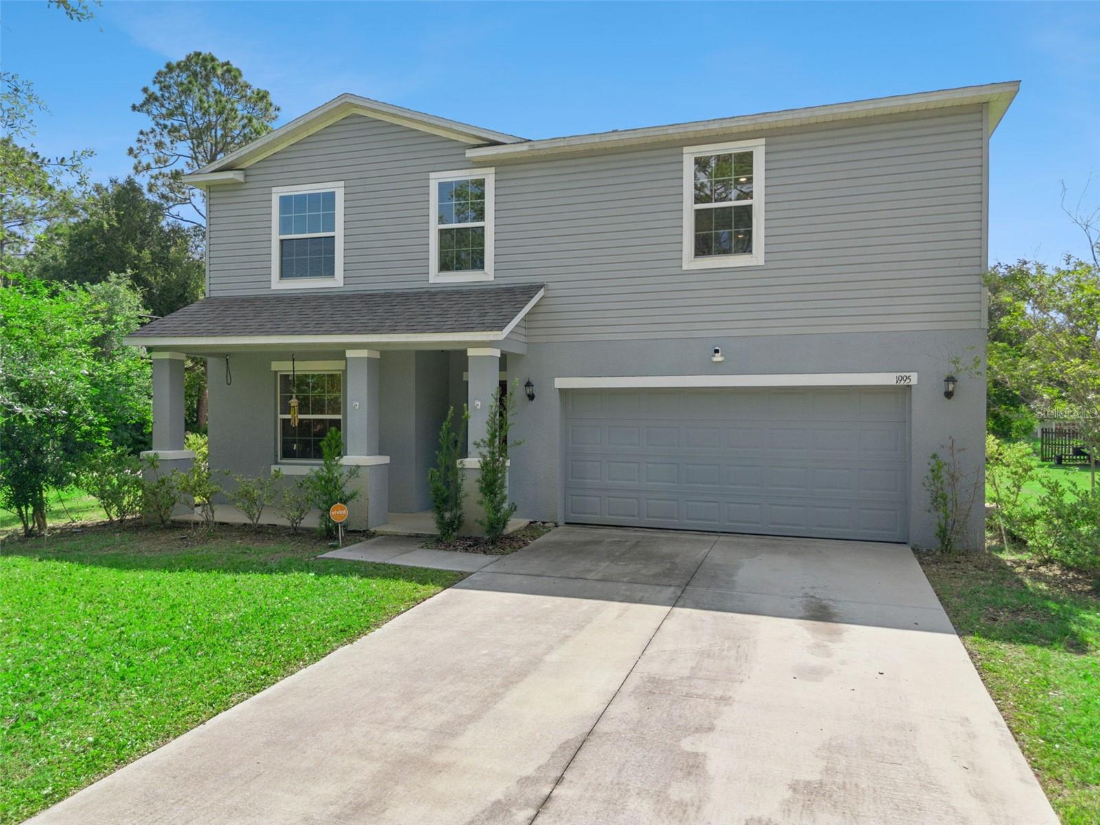 Welcome to 1995 5th Avenue in DeLand, where modern construction meets the perfect blend of country charm and city convenience. Built in 2022, this beautifully maintained 4-bedroom, 2.5-bath home offers all the benefits and peace of mind of newer construction, paired with a thoughtfully designed floor plan.  The oversized backyard provides ample space for a custom pool, outdoor kitchen, playground, garden, or recreational activities.

Step inside to an inviting open-concept layout that's ideal for both everyday living and entertaining. The spacious kitchen features granite countertops, stainless steel appliances, a breakfast bar perfect for casual dining or helping with homework, a cozy breakfast nook, and a separate formal dining room for special occasions. Sliding glass doors fill the space with natural light while providing beautiful backyard views and easy access to the outdoor living area.

Upstairs, you'll find a generous loft that offers endless possibilities as a media room, home office, playroom, or flex space. The oversized primary suite serves as a private retreat with large walk-in closets and a spacious en-suite bath designed for comfort and functionality. Three additional bedrooms are generously sized and offer ample closet space. The secondary full bath features dual vanities and a convenient tub/shower combination.

Outside, enjoy the tranquility of a spacious backyard with plenty of room for a swimming pool, backyard entertaining, or games of baseball and soccer. The installed solar system helps keep monthly electric bills low, providing exceptional long-term energy savings. A two-car garage adds convenience and additional storage.

Ideally located just minutes from shopping, dining, schools, and all that DeLand has to offer, this move-in-ready home combines modern amenities, spacious living, energy efficiency, and an unbeatable location. Don't miss your opportunity to make this exceptional property your new home!
