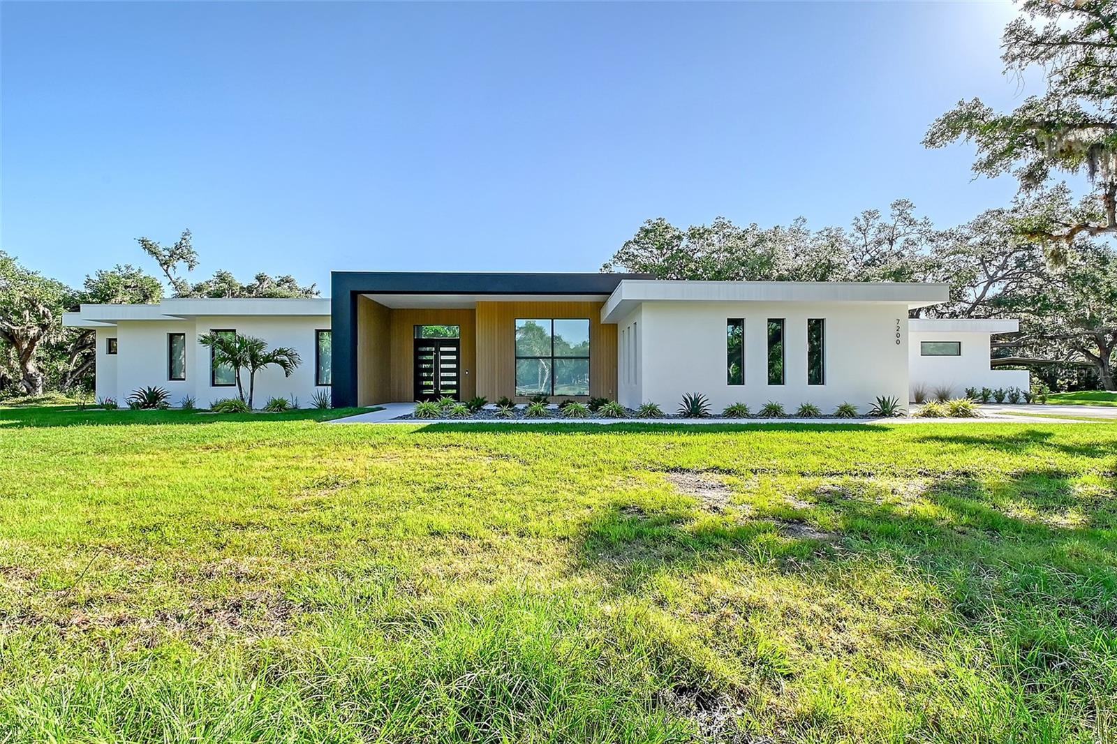 One or more photo(s) has been virtually staged. Experience unparalleled luxury and privacy with this brand new modern masterpiece custom-built by Jonas Yoder Homes. Nestled on 6.7 lush acres with mature trees, this exclusive estate features a stunning 4-bedroom, 4-bath main residence plus a fully equipped 1-bedroom guest house with living room, kitchen, and full bath—ideal for extended family or guests.

Crafted with meticulous attention to detail, the home boasts sleek Thermador appliances, induction cooking, a spacious butler’s pantry, and Lutron smart shades throughout. The expansive master suite offers a serene retreat with spa-like finishes, while each additional bedroom enjoys its own en-suite bath.

A rare find, the property also includes a private airplane hangar, a cooled garage, brand new septic system, and a new well—delivering both modern convenience and future-ready infrastructure. Uniquely, this property is the only one in the community confirmed by the HOA to have the potential for a private runway for small aircraft, offering a truly unmatched aviation lifestyle opportunity.

Designed for those who value privacy, luxury, and exceptional quality—all in a prime location.