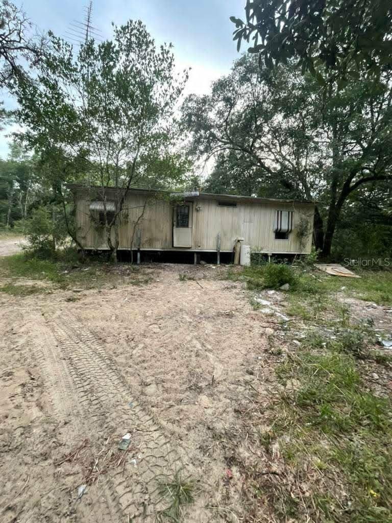 Rare opportunity to own 2.38 acres in Dunnellon with two homes already situated on the property. The parcel offers flexibility for investors, renovators, and buyers seeking rental income potential or country living with room to spread out. Both homes will require updates and repairs, creating an excellent value-add opportunity. A-2 zoning provides additional flexibility for a variety of residential and agricultural uses. Conveniently located near Dunnellon, Rainbow Springs, and Ocala while still offering privacy and space.