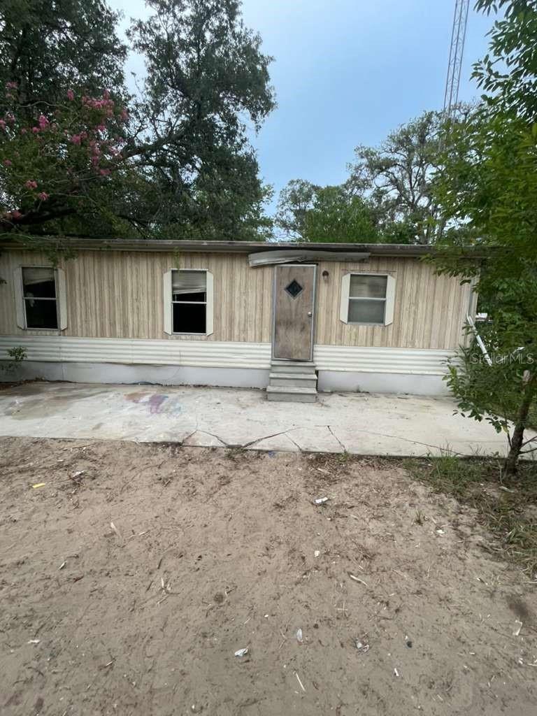 Rare opportunity to own 2.38 acres in Dunnellon with two homes already situated on the property. The parcel offers flexibility for investors, renovators, and buyers seeking rental income potential or country living with room to spread out. Both homes will require updates and repairs, creating an excellent value-add opportunity. A-2 zoning provides additional flexibility for a variety of residential and agricultural uses. Conveniently located near Dunnellon, Rainbow Springs, and Ocala while still offering privacy and space.
