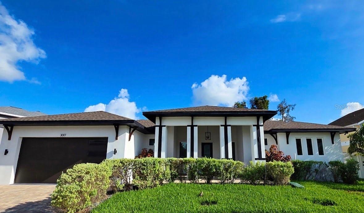 BEST VALUE WATERFRONT Lifestyle on a Premium Canal in Hidden Lagoon. Welcome to 3017 Pine Street, Bradenton, a stunning coastal modern canal-front estate where luxe design, new construction peace of mind, and true Florida boating lifestyle come together.

Step inside this 2022-built masterpiece, crafted to strict wind codes with high-efficiency systems to keep you comfortable and your operating costs low. The vibe is clean, bright, airy and contemporary, with an open-concept layout that frames the water as the star of the show. You are welcomed by beautiful bright porcelain tile flooring. 

This gorgeous 3 bedroom tailor- made home, plus bonus room ideal for office, media room, or flex space offers coastal modern living.  The sun-drenched great room boasts waterfront views that spill in from oversized windows. The seamless flow from living, dining, and kitchen to outdoor spaces makes this home perfect for hosting guests. 

This is a true chef’s and entertainer’s kitchen with all the WOW factors including sleek stainless steel appliances, designer quartz countertops with a dramatic waterfall-edge island, expansive island seating that invites guests to linger and gather, and plenty of storage and prep space for effortless everyday living or festive gatherings. 

The primary suite is a private sanctuary for that relaxing retreat from the day. The generous bedroom offers a seating area and a large his and hers walk-in closet. The master ensuite bath is “spa inspired” for ultimate pampering with dual-sink vanity, a custom Calcutta tile walk-in shower, and refined finishes that give the feel of a boutique hotel. 

This canal front homesite is a boater’s paradise. Owners will enjoy deep canal views from inside and out of the home. The exterior features elegant brick pavers hard-scape for low-maintenance. Bring your boat and enjoy a short cruise to the Manatee River with direct access out to the Gulf of Mexico. Whether it’s sunrise coffee by the water, afternoon paddle sessions, or sunset cruises to dinner, this address puts you in the heart of the best of Bradenton’s coastal lifestyle.

Live tucked away on a quiet street while staying close to everything. Just minutes to downtown Bradenton for dining, arts, and cultural events. Some highlights include: The Bradenton 1.5 mile Riverwalk, the Pittsburgh Pirates spring training stadium, the Bishop’s Museum of Science and Nature, and the Ellenton Outlet Mall and Ice Skating complex.  Smooth access to I-75 and 275 – ideal for St. Pete and Sarasota commuters. Proximity to  top-rated A+ private/charter schools. And ideally located with easy access to world-class Gulf beaches, parks, and shopping. 3017 Pine Street is more than a home,  it’s a turnkey coastal modern estate designed for those who demand style, quality, and the freedom to live on the water. Schedule your private showing today and experience canal-front living at its finest. Seller is open to short term seller finance, lease to own, or a rate buy down scenario. Seller is willing to negotiate the addition of a pool and/or lift.