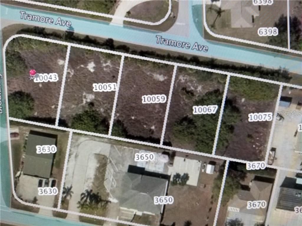 Looking for affordable land to build that storage facility, warehouse, workshop etc.? Need room for Boats, RV's, trailers and more? This could be it! Priced under $160K for five parcels, this could absolutely be the best deal around within these criteria. There may be others out there but reasonably priced makes the difference. Port Charlotte/Englewood are growing, and centrally located acreage is getting harder to find!  
5 vacant lots in a row totaling approximately 1.16 acres.  Each lot is 125Lx80W (10,000 +/-) square feet, and the corner is almost 11,000 sf., giving you about 1.16 +/- acres of property. That is a total combined length of 400 feet. Build separate structures per parcel one at a time or combine all into one for a larger "all at once" project. All the Scrub Jay fees have been paid by sellers prior, so there aren't those costs to worry about. The interior of the land has minimal to no trees on the property as seen in the aerial photos, but the outside perimeter has matured vegetation all around it. All the surrounding roads have recently been repaved too! The east end of the property has a fire hydrant located on it (good to know), which comes off a 6-inch main I was told, but please verify for yourself.
Zoned PD and/or CG, (planned dev/comm. gen.) warehouse, retail and more. 
The nearest major intersection is State Route 776 & Spinnaker Boulevard (stoplight). Venice is only about 20 minutes away, and Port Charlotte is just about a 15-minute drive from this area/location.
Planned Development (PD) zoning is a flexible approach to land use regulation that serves as an alternative to traditional zoning, which rigidly segregates land uses like residential, commercial, and industrial into separate districts.  Instead of forcing a project to conform to a one-size-fits-all set of rules, PD zoning allows for the creation of a unique, tailored plan for a specific property. This process is intended to encourage innovative design and unified development, especially for larger or more complex projects. 
There are no deed restrictions, and these commercial lots can be rezoned to fit your needs. 
Please check with Charlotte County with situs/zoning questions to verify.