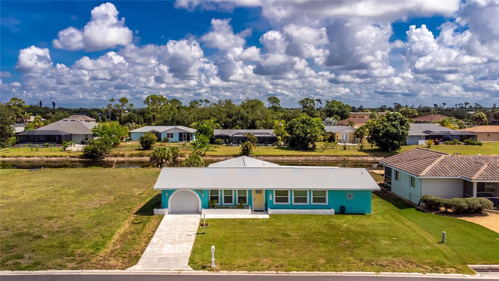 JUST RENOVATED & SHOWS LIKE NEW! Welcome to your waterfront paradise in Rotonda West! This spectacular 4-bed, 2-bath home plus den sits right on a peaceful canal and radiates a fun, modern beach vibe.
What’s New? Everything!
• Brand-new impact windows & doors for total peace of mind
• Chef's kitchen with quartzite counters & soft-close cabinets
• Luxury vinyl flooring & fresh paint inside and out
• Huge, screened lanai with custom epoxy floors
Perfect as a forever home, a vacation getaway, or a lucrative rental investment.  This Florida gem is ready for you to move right in and start enjoying the paradise lifestyle!! ASSUMABLE FLOOD INSURANCE AT A GREAT RATE. CALL TODAY to schedule your showing!!!