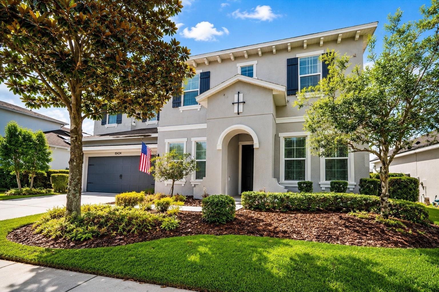 Welcome to this beautifully appointed pool home in the highly sought-after Starling at FishHawk Ranch, where timeless finishes, functional spaces, and resort-style living come together perfectly.  From the moment you enter, you'll appreciate the rich wide-plank wood flooring, elegant crown molding, upgraded baseboards, and abundant natural light throughout. A private double-door home office with wainscoting on the first floor provides the ideal work-from-home space, while the nearby half bath adds convenience for guests.  The open-concept floor plan is designed for everyday living and effortless entertaining. The spacious great room, dining area, and eat-in kitchen flow seamlessly together, all overlooking the sparkling pool and spa and fully fenced backyard. The kitchen features stainless steel appliances, a gas range, recessed lighting, ample cabinetry, and a breakfast bar perfect for casual meals or gathering with family and friends.  The first-floor primary suite is a peaceful retreat.  The bathroom is adorned with tray ceilings, walk-in closets, split double vanities, a garden tub and separate walk-in shower.  Upstairs, you'll find generously sized secondary bedrooms with ceiling fans and deep closets, along with a huge bonus room that can serve as a media room, playroom, fitness area, or second office—flexibility to fit your lifestyle. The indoor laundry room is conveniently located downstairs-outside the three-car tandem garage.  Step outside to your private backyard oasis featuring a covered lanai for dining or lounging, a pavered pool and spa, and tranquil waterfall features—all within a fully fenced yard offering privacy and room to play.  Residents of Starling enjoy access to exceptional amenities including the Starling Club with a game room, a community pool, dog parks, playgrounds, tennis courts, and miles of scenic walking and biking trails.  This home offers the perfect blend of luxury, comfort, and the vibrant lifestyle that makes FishHawk Ranch one of the Tampa area's most desirable communities.
