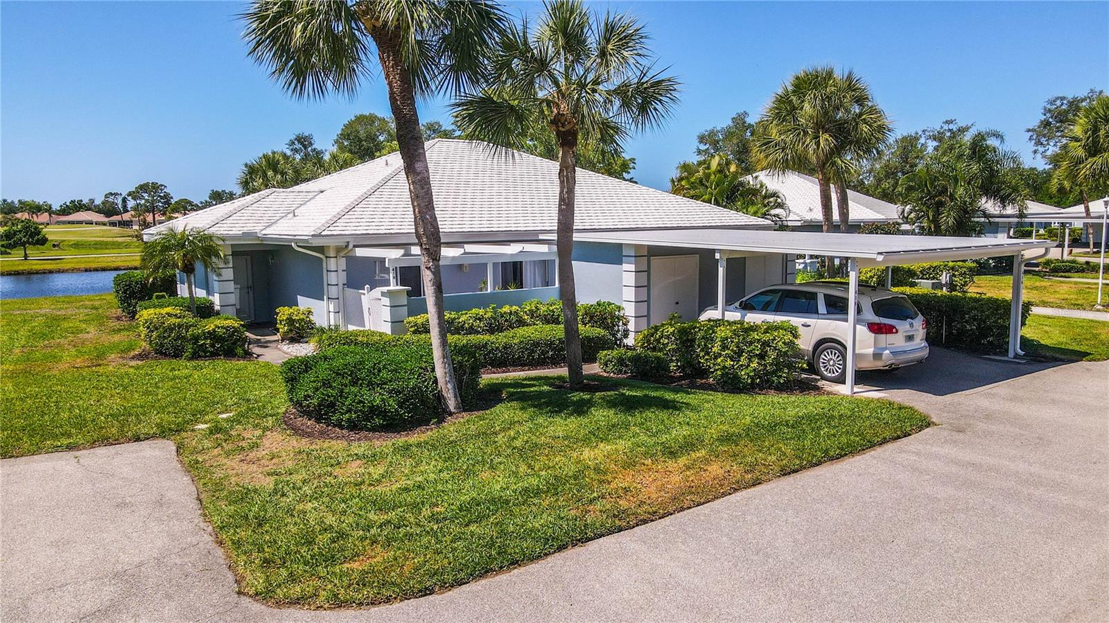 Experience the best of Florida living in this stylish two-bedroom, two-bathroom villa offering serene water views.  Designed for both relaxation and entertaining, the open-concept floor plan features a bright living area filled with natural light and includes an impact glass enclosed lanai that complements the Florida lifestyle.
The kitchen boasts solid wood cabinets with soft-close doors and drawers and has been remodeled for added space.  Other features include. New A/C system in 2026, new water heater 2021, new 150amp electric service/panel 2020, new carport and roof…nothing left but years of worry-free enjoyment.
This move-in-ready villa is being offered turnkey furnished and is located within the Plantation Golf & Country Club community.  Membership is available but not mandatory.  The club offers exceptional amenities such as a 2 champion ship golf courses, heated pool, clubhouse, fitness center, tennis and pickleball courts.
Perfectly situated near shopping, dining, beaches, and major highways, this waterview villa combines comfort, luxury, and convenience—your very own slice of Florida paradise awaits.