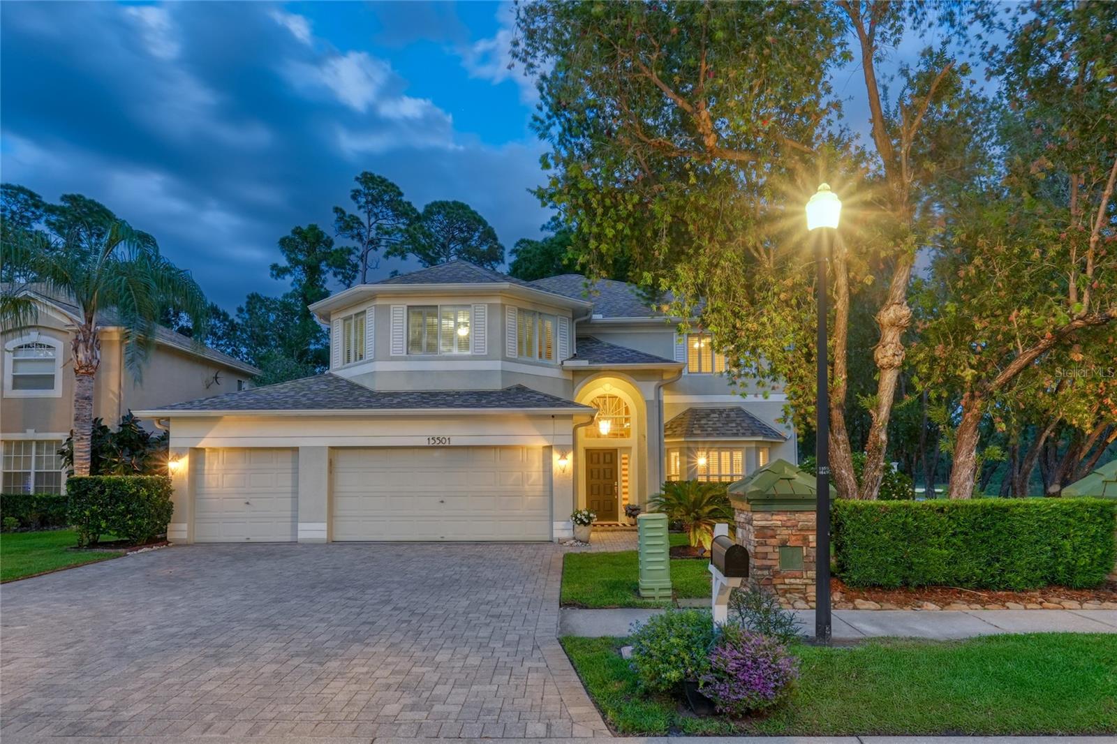 One or more photo(s) has been virtually staged. The Eagles! Positioned on a premium corner homesite along the signature island-green 6th hole of the Forest Course, this pool home in The Eagles offers a rare combination of privacy, space, and golf course views. Featuring a huge oversized fully fenced backyard—considered one of the best lots in the neighborhood—with no side or rear neighbors and located in the highly desirable front section of the community, this west-facing home delivers both convenience and a peaceful setting. Please view the custom walkthrough as well as 3D video! Offering over 3,100 square feet, this two-story residence features 4 bedrooms + large bonus room, 3 full bathrooms, a 3-car garage, and a flexible layout designed for today’s lifestyle. A grand two-story foyer opens to formal living and dining spaces, enhanced by hardwood flooring, plantation shutters, and abundant natural light. The kitchen is both functional and inviting, with 42” cherry cabinetry, granite countertops, stainless steel appliances including a newer refrigerator and dishwasher, a prep island, walk-in pantry, and an eat-in area overlooking the pool and golf course. It flows seamlessly into the family room, creating a natural gathering space. A full bedroom and bathroom on the main level provide flexibility for guests or a home office. Upstairs, the primary suite offers a private retreat with a large walk-in closet and updated bath featuring dual vanities, a soaking tub, and a walk-in shower. A second-floor laundry room adds everyday convenience, while a spacious bonus room offers additional flexibility for a 5th bedroom, media room, gym, or playroom. Outdoor living is a standout feature, with a heated saltwater pool, brick paver deck, and open golf course views—perfect for entertaining or relaxing year-round. The fully fenced backyard—an uncommon and highly desirable feature within The Eagles—provides added privacy and usable space for pets, play, or outdoor enjoyment. Recent improvements including fresh mulch, professionally trimmed palm trees, and a full exterior pressure washing enhance the home’s clean, move-in ready presentation. Additional recent improvements include freshly painted interior spaces, contributing to the home’s bright and well-maintained feel. Major updates include a roof replaced in 2017, A/C and ductwork (2015), newer compressors, interior A/C units replaced approximately one year ago, A/C systems with UV light filtration, whole house flooring and carpet (2018), and a fence installed in 2016. Additional features include plantation shutters throughout and smart home integration with Nest, Google Smart, and WiFi-enabled Google Home. Located in The Eagles, a 24-hour guard-gated golf course community with two championship courses, residents enjoy abundant green space, wildlife, and zoning for A-rated schools—Mary J. Bryant, Farnell, and Sickles. Low HOA and no CDD.A well-positioned home offering privacy, flexibility, and golf course living in one of Odessa’s most established communities.