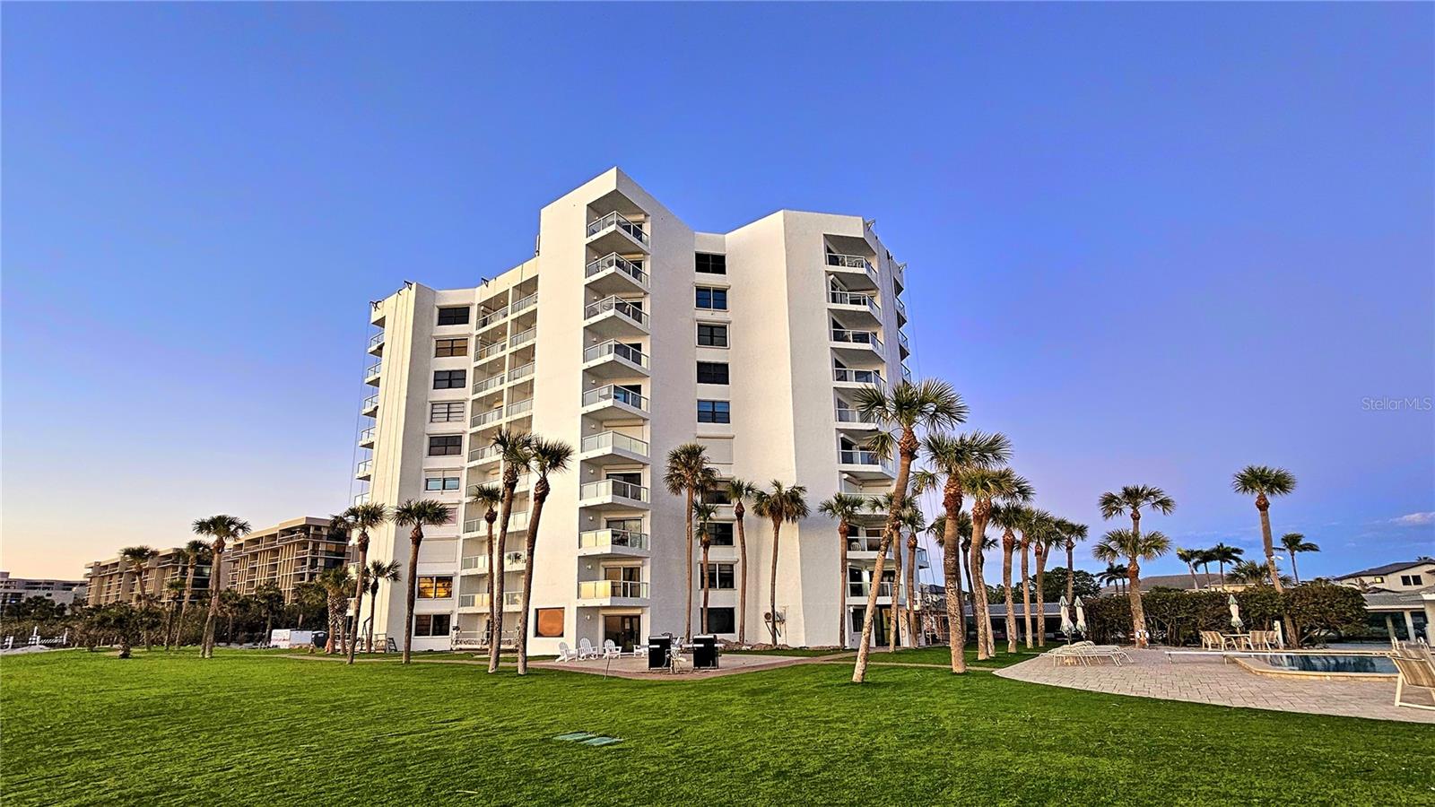 Experience elevated coastal living in this beautifully renovated two-bedroom, two-bath golf-front condominium, ideally situated behind the gates of the prestigious Longboat Key Club in the sought-after community of Privateer South on Longboat Key. Thoughtfully redesigned with a refined coastal aesthetic, this residence showcases a seamless blend of modern elegance and relaxed waterfront living. From the moment you enter, you are welcomed by an open-concept layout filled with natural light, enhanced by expansive windows and tranquil golf course views. The fully updated kitchen features sleek cabinetry, premium finishes, and a clean, contemporary design that flows effortlessly into the spacious living and dining areas—ideal for entertaining guests or enjoying quiet evenings at home. Every detail has been carefully curated to provide both style and functionality. The primary suite offers a serene retreat, complete with a beautifully appointed en-suite bath and generous closet space, while the guest bedroom and bath provide comfort and privacy for visitors. Both bathrooms have been tastefully renovated with modern fixtures and finishes, creating a spa-like atmosphere throughout the home. Residents of Privateer South enjoy a true resort-style lifestyle with an impressive array of amenities. Relax by the sparkling beachfront pool overlooking the Gulf of Mexico, maintain your wellness routine in the fully equipped fitness center, or gather with neighbors in the inviting social room. On-site management ensures ease of ownership and peace of mind. Perfectly positioned between the Gulf and Sarasota Bay, this exceptional property offers convenient access to world-class dining, shopping, and cultural attractions, all while being tucked away in a secure, gated enclave. Whether you are seeking a full-time residence or a luxurious seasonal retreat, this golf-front condominium delivers the very best of Longboat Key living.