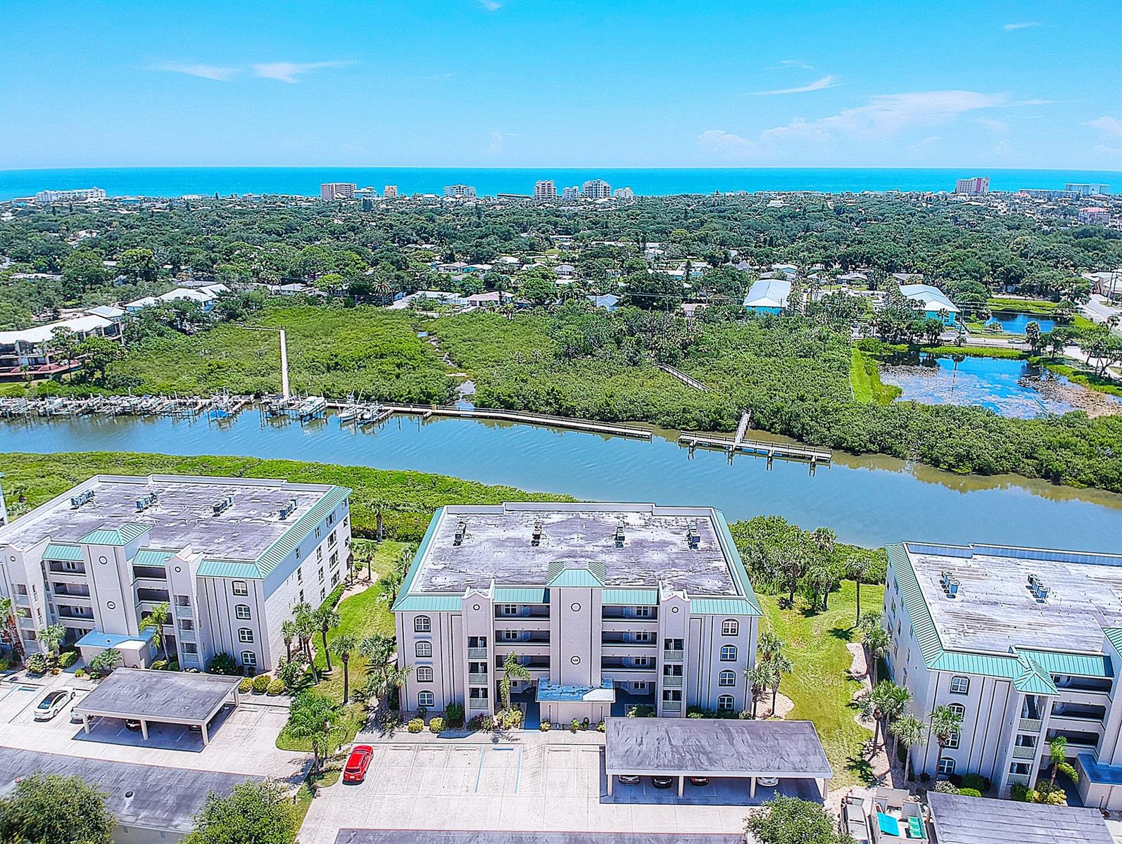 Move in Ready!  This Highly sought after 1st floor, 2 bed/ 2 bath unit is DIRECTLY ON Callalisa Creek in Bouchelle Island boasts incredible water views where you can watch graceful marine life, and bask in warm coastal breezes. Being sold completely furnished, this turnkey unit offers a desirable open floor plan with split bedroom design.  The updated kitchen features SS appliances, beautiful cabinets and granite counter tops with expansive breakfast bar.  The spacious master bedroom offers private access to the porch and its bath boasts double sink, luxurious garden tub and step-in shower. Other features include walk in closets, brand new IN UNIT washer and dryer, upgraded bathroom fixtures and newer AC.  The community friendly association offers residents a lot to do! From kayaking/or canoeing on peaceful Callalisa Creek or taking part in a variety of community events at the clubhouse & the many other amenities that include, 2 heated pools, tennis court, shuffleboard, putt-putt golf, private boat ramp, river walk, and fishing pier. Also offered are Boat Slip Rentals and dry storage spots. Reserved owner parking space under carport conveys w/sale. Enjoy maintenance free living and convenient beachside location near to everything that NSB has to offer. ;LocationDescription: Condo ;Water: City