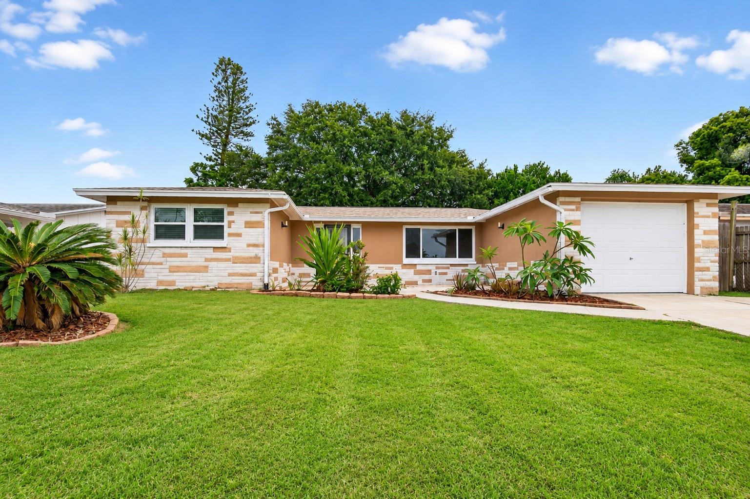 Move-in ready and packed with value! This charming 2-bedroom, 2-bath block home with a 1-car garage is an excellent choice for first-time buyers, snowbirds, or anyone seeking an affordable Florida retreat. Enjoy peace of mind knowing the major updates have already been completed, including a newer roof, air conditioning system, and tankless water heater. The functional floor plan offers comfortable living spaces with plenty of opportunity to personalize and make it your own.

Conveniently located near shopping, dining, beaches, and just minutes from the famous Tarpon Springs Sponge Docks, this home combines location, affordability, and big-ticket improvements. Whether you're looking for a primary residence, second home, or investment opportunity, this property is a must-see!