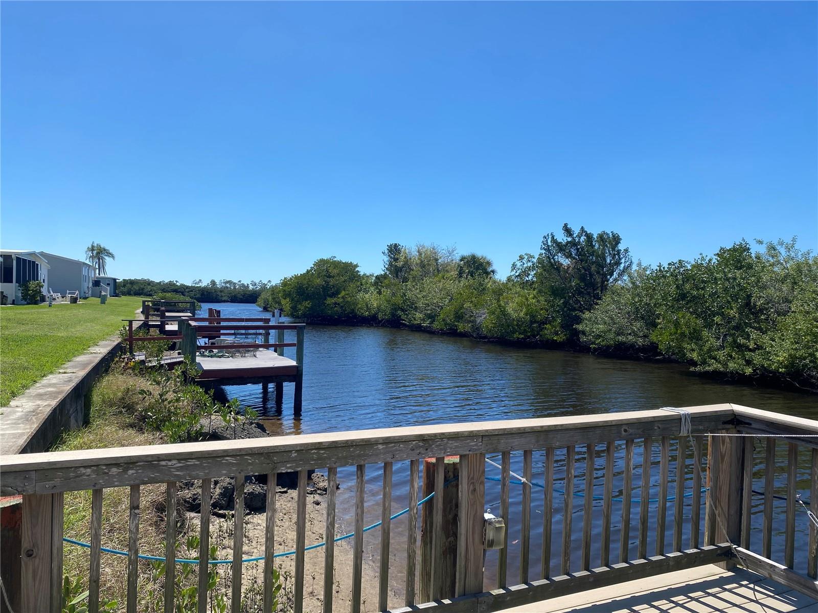 Price Improvement!! Exceptional value for WATERFRONT LIVING!! Bring your boat to this Resort Style Living 55+ Community with Your Very Own Private Boat Dock with stellar canal views. From the moment you step inside, you’ll fall in love with the light and bright kitchen featuring an oversized bar perfect for casual dining or entertaining. Work from home? No problem, this home features a large office with built in office space! The spacious main suite offers a true escape, with a large bedroom and ensuite bathroom. Stretch out and enjoy the outdoors in the large sunroom that spans the back of the home - Enjoy those brisk nights using the fireplace---perfect for soaking in views of the private backyard and canal. Truly one of a kind property with a boat dock in your backyard - don’t let this gem slip away!