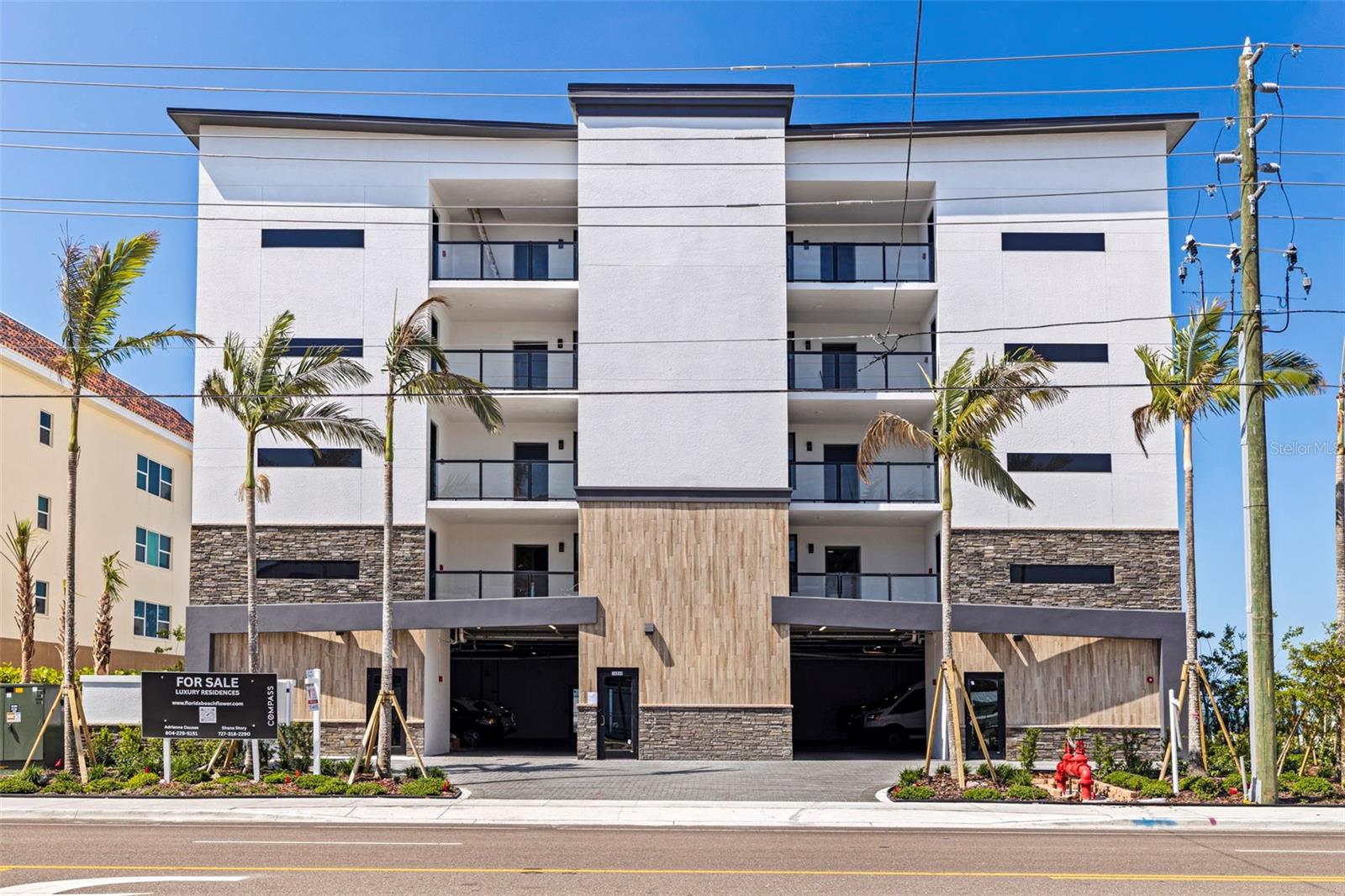 One or more photo(s) has been virtually staged. Welcome to a rare opportunity to own one of only eight exclusive residences in an architecturally stunning new Gulf-front development on Madeira Beach. With expanded square footage, this exquisitely designed building blends modern luxury with coastal sophistication, all set against the breathtaking backdrop of direct Gulf views and unforgettable sunsets. Each residence offers high-end finishes, an expansive covered outdoor living area, and only two units per floor—providing privacy, space, and sweeping vistas from nearly every room. This particular unit features two spacious bedrooms, two elegant bathrooms, and a versatile den—ideal for a home office, media room, or guest space. Inside, you’ll find a thoughtfully curated interior, including engineered wood flooring with sound mat underlay, luxury carpet in the second bedroom and den, and custom tile work throughout. The gourmet kitchen is a showpiece with stainless steel appliances, designer backsplash, and an elevated cabinetry package for both kitchen and bathrooms. Solid core doors and premium hardware complete the refined aesthetic. The master en-suite bath showcases a spa-inspired design with large format tile, art-deco accent wall, and a custom shower floor. The second bath is equally luxurious with a tub. Outside, the amenities continue with a beachfront pool and spa, an expansive paver deck, and beautifully landscaped grounds with a full irrigation system and exterior lighting. Under-building parking and a private elevator round out the ease and exclusivity of ownership. This is more than a condo—it’s a statement in refined Gulf-front living!