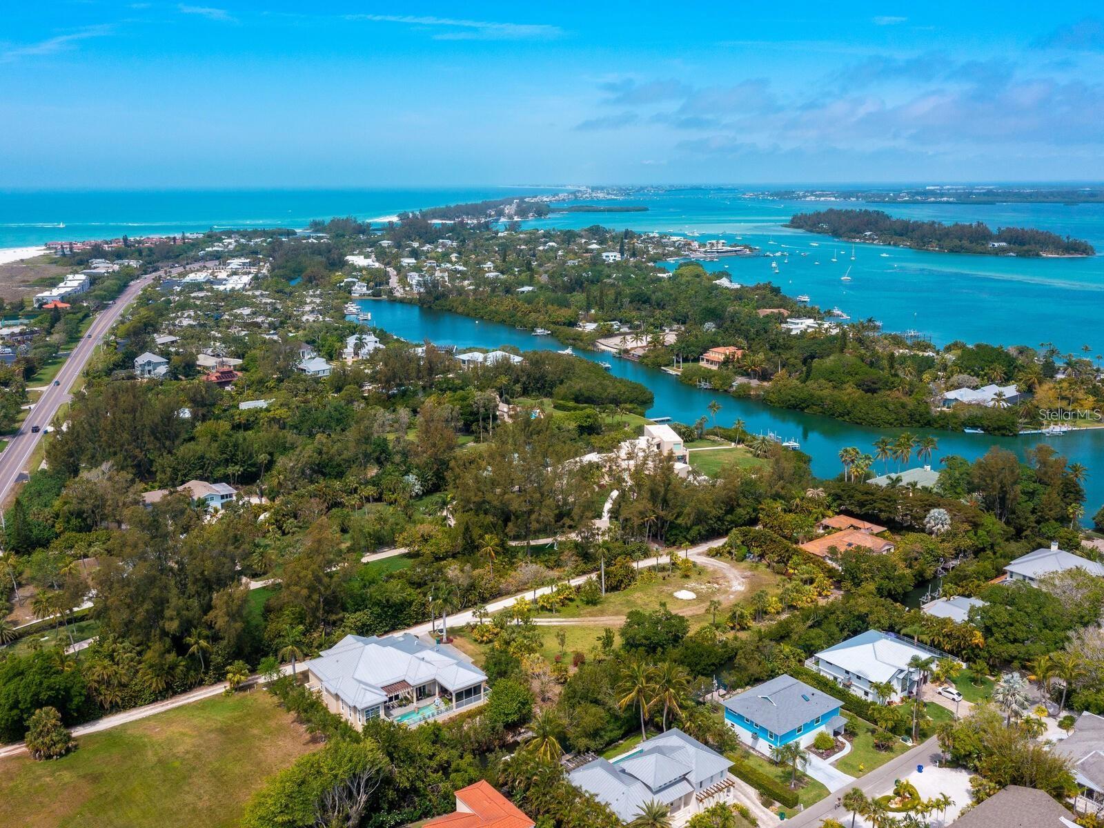 Privacy is key for this sprawling, estate-size lot tucked down a quiet street on the north end of Longboat Key. While addressed on Gulf of Mexico Drive, the property is uniquely positioned off the main roadway, set back beyond three estate-sized parcels, offering a tranquil, quiet and peaceful canal-front setting. This rare location offers one of the largest single-family home lots available on Longboat Key and provides a blank canvas to build your dream home, nearly one acre of land, creating the ultimate family estate and a rare opportunity in this area. Featuring approximately 280 feet of canal frontage with access to Sarasota Bay and the Intracoastal Waterway, this sought-after location invites you to fully immerse yourself in the island lifestyle. Enjoy deeded beach access just across the street, where white sand beaches and the sparkling waters of the Gulf of Mexico await. Ideally just a short drive from the shopping and dining of St. Armands Circle, along with golf, tennis, boating, Holmes Beach, Anna Maria Island and all the Sarasota–Bradenton area has to offer, you really can have it all.