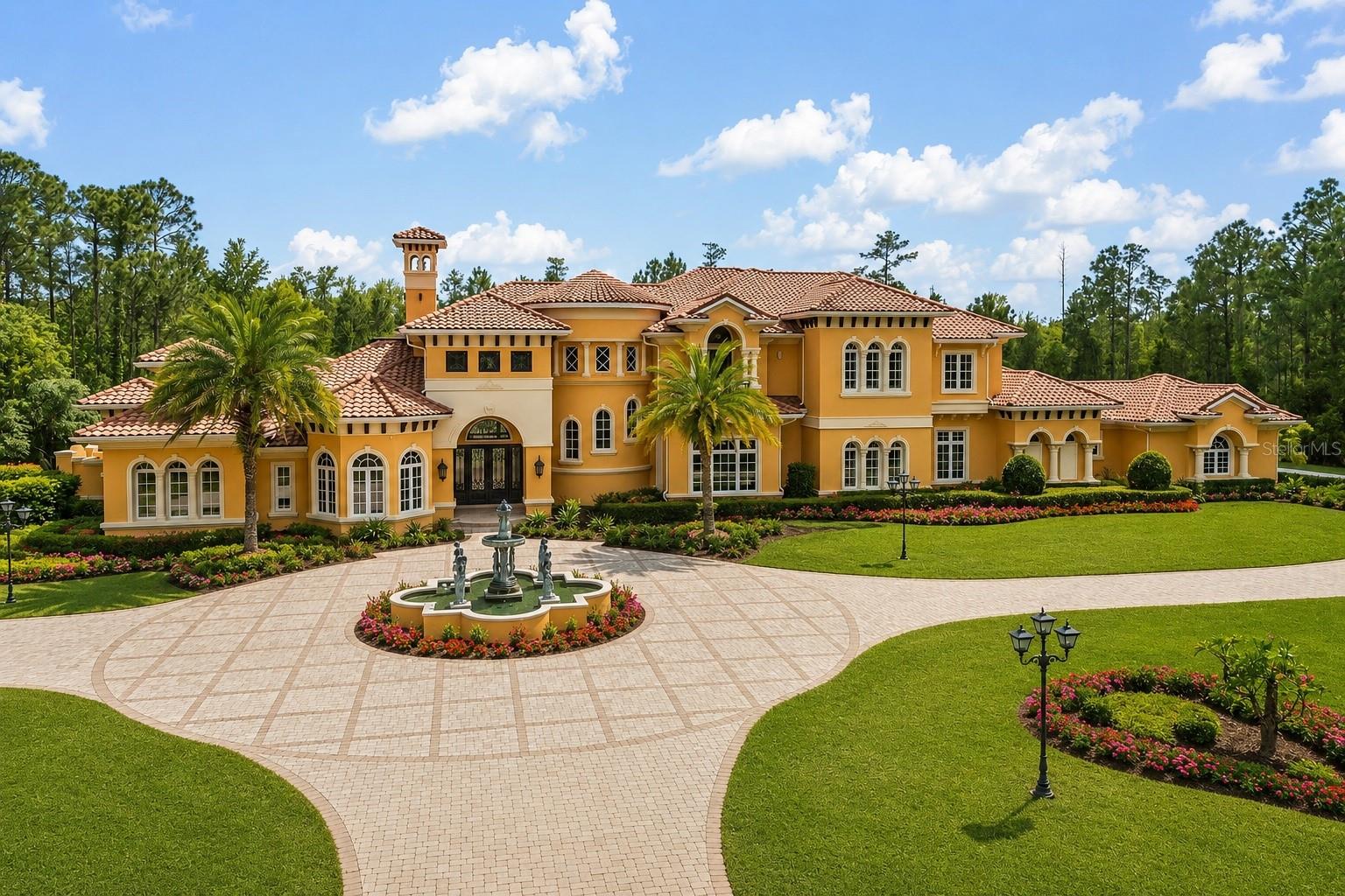 Welcome to a truly unparalleled luxury estate, nestled on 5 acres of serene privacy. This custom-built masterpiece, completed in 2009, boasts an impressive 11,138 square feet of meticulously designed living space, where every detail has been thoughtfully curated for the discerning homeowner.

As you enter through the private gate, you are greeted by a stunning family room featuring a handcrafted stone gas fireplace and soaring ceilings that create an inviting atmosphere. The elegant curving marble staircase, adorned with a magnificent Swarovski crystal chandelier, sets the tone for the opulence that awaits.

This estate offers 5 spacious bedrooms, each with large walk-in closets and en-suite bathrooms, ensuring comfort and privacy for family and guests alike. The main living areas are enhanced by exquisite woodwork, including a gorgeous dining room and a living room that seamlessly connects to the outdoor oasis through sliding glass doors that open at the corner, perfect for entertaining.

Indulge in the ultimate entertainment experience in the media room, complete with luxurious seating and a stunning chandelier commissioned from Tiffany's in New York. The primary suite is a true retreat, featuring a cozy sitting area and an expansive closet. Additional highlights include a gym with a steam room, an office/study/library, and an upstairs game room that overlooks a spacious covered balcony.

The outdoor amenities are equally impressive, featuring a large pool with a spa, ample undercover seating, an outdoor kitchen, and tennis courts, all surrounded by lush landscaping and majestic oak trees. The estate also includes a wine cellar, a wet bar with custom woodwork, and coffered ceilings adorned with unique prints.

With a 4-car side garage and an attention to detail that is truly one of a kind, this estate is unlike anything you have ever seen. Experience luxury living at its finest—schedule your private tour today and discover the extraordinary lifestyle that awaits you.