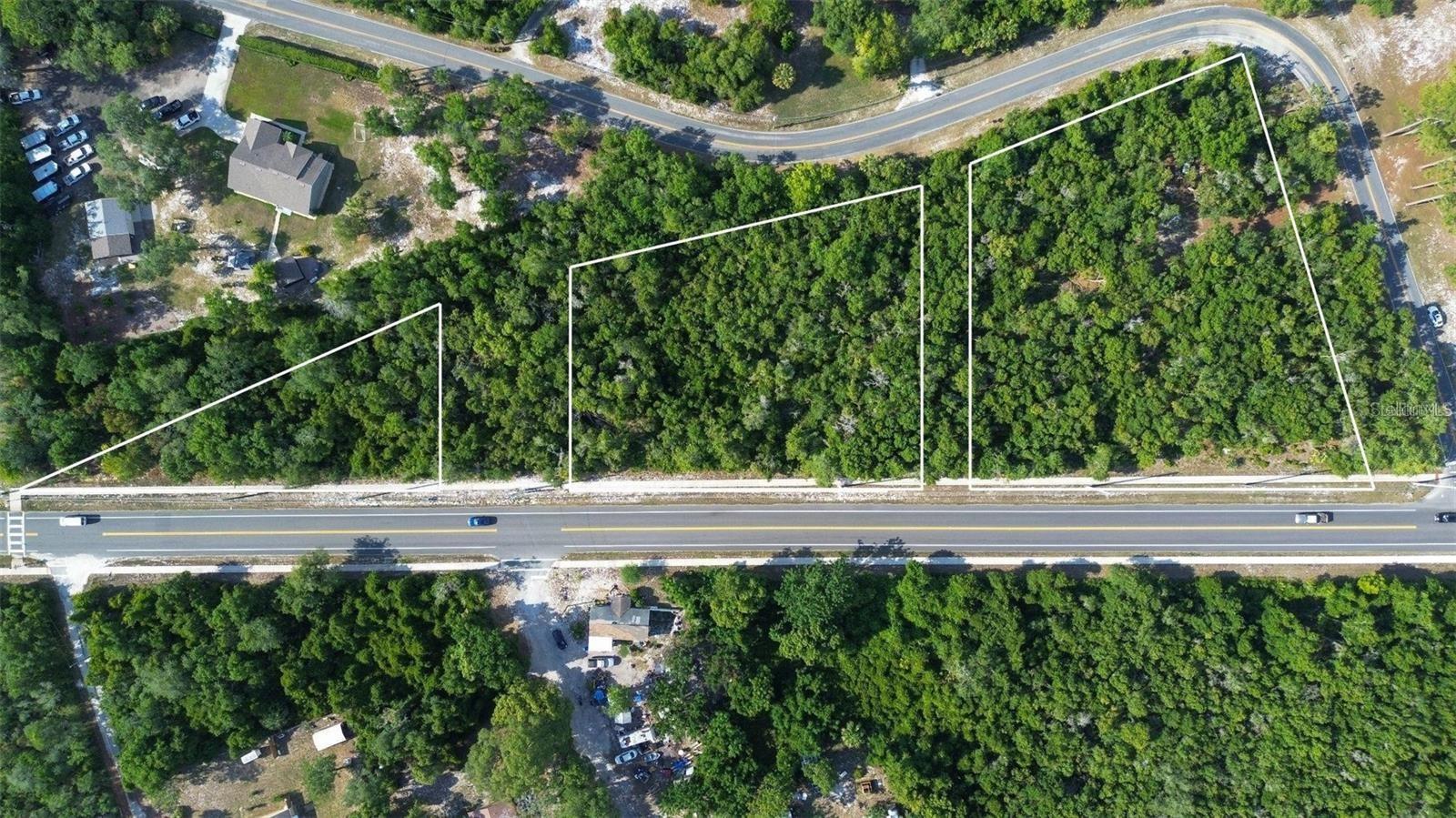 New price adjustment. Very large frontage on Doyle Road in the developing area of Deltona. This sale includes 2 parcels. The 2 larger lots are now combined to over 2 acres ready to start planning your dream home.  The sale also includes the smaller lot. Overall, the parcels total just under 3 ACRES (total to be verified by buyer's survey during due diligence). Zoned residential to build your dream home. Could possibly be rezoned to multi-use or commercial (zoning
options/allowed uses to be verified with Volusia County). Lovely, wooded views and desirable location with notable nearby features including
Audubon Park and the East Central Regional Rail Trail. In less than 30 minutes, you have beautiful beaches and 2 large airports. Theme Parks, attractions, and the Orlando Airport are less than an hour away! Close to schools, hospitals, shopping, Lake Monroe, and many other
desirable sites. Now is the time! **All information provided is deemed reliable but is not guaranteed and was provided solely by seller
and/or public records. Buyer/Buyer's agent must independently verify all property information with appropriate governing bodies and
professionals such as surveyors, inspectors, and land use attorneys. Buyer/Buyer's agent to verify property tax amount as it may not reflect
the total of all 3 parcels individually or as combined. **