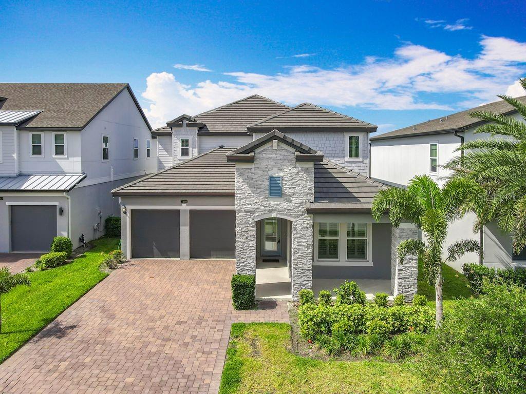 Welcome to modern luxury in the highly coveted, gated community of Sand Lake Sound! Nestled in the heart of Dr. Phillips, this stunning 5-bedroom, 3.5-bathroom residence offers a spacious expertly designed heated living space. Step inside to an expansive, sun-drenched open concept floor plan featuring a spectacular great room, high ceilings, and a gourmet kitchen that seamlessly flows into the dining and living areas—perfect for effortless entertaining. The highly desirable layout features a private master suite conveniently located on the first floor, complete with an upgraded spa-like bathroom and an oversized walk-in closet. Large windows frame gorgeous, serene views of Big Sand Lake, offering a front-row seat to the spectacular evening Orlando Eye light shows.   Enjoy direct backyard access to the lake with the exciting potential to build your own private boat dock and lift (subject to HOA and county permitting), making this a true boater's paradise!. Residents enjoy exclusive resort-style community amenities, including a sparkling pool, passive park, playground, and direct lake access. Best of all, you are just minutes away from Dr. Phillips’ famous Restaurant Row, Whole Foods, highly rated schools, and Orlando’s world-class theme parks (Disney, Universal, and SeaWorld)! Don't miss this opportunity to live the ultimate Florida lifestyle. Schedule your private showing today!
-